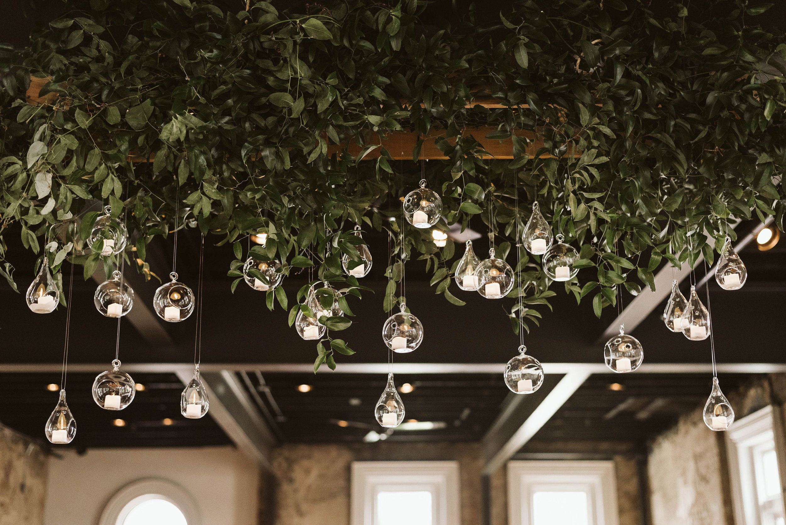 Hanging candle installation with untamed greenery // Tennessee Wedding Floral Design