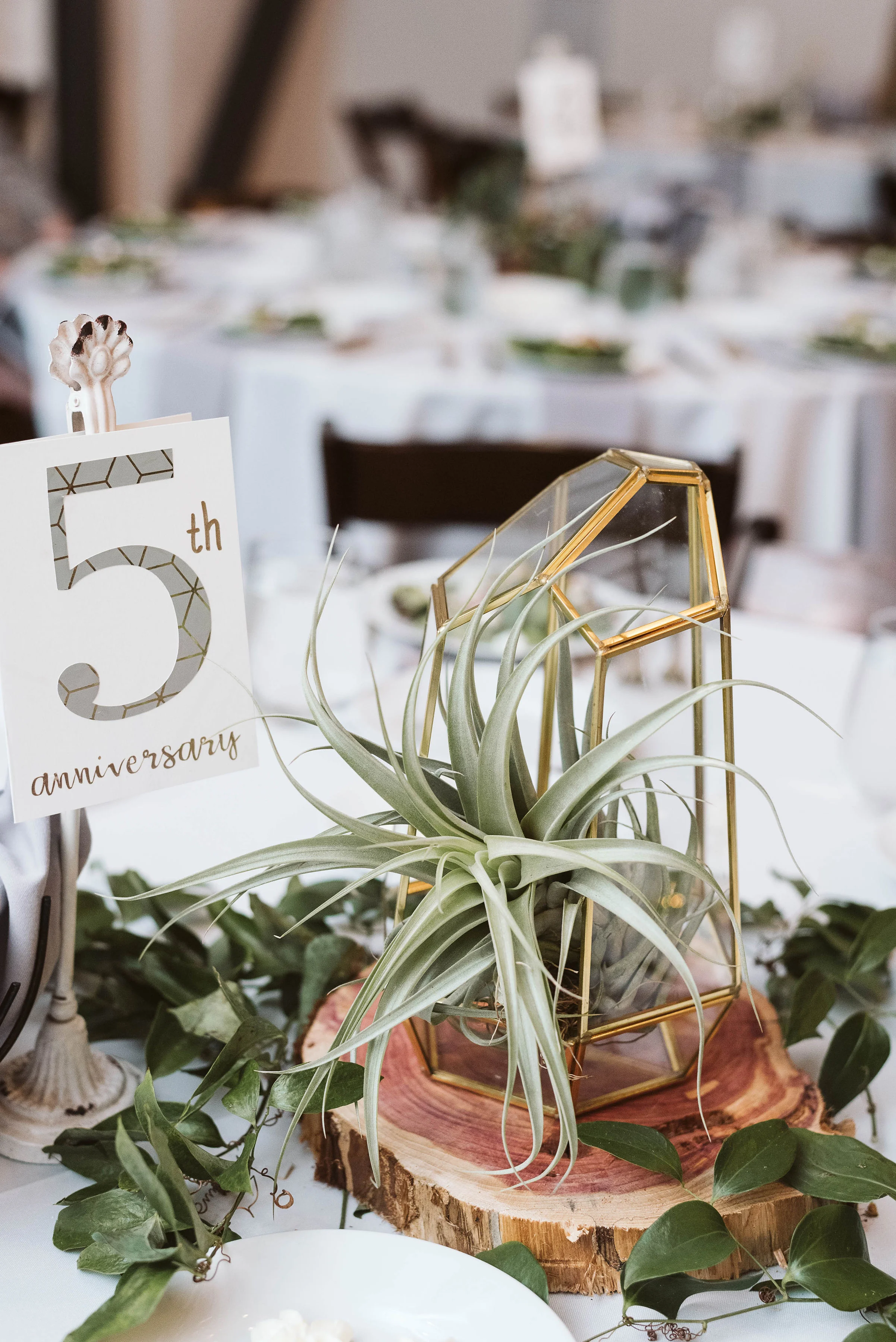 Gold geometric terrarium centerpiece with an air plant and greenery // Nashville, TN Wedding Florist