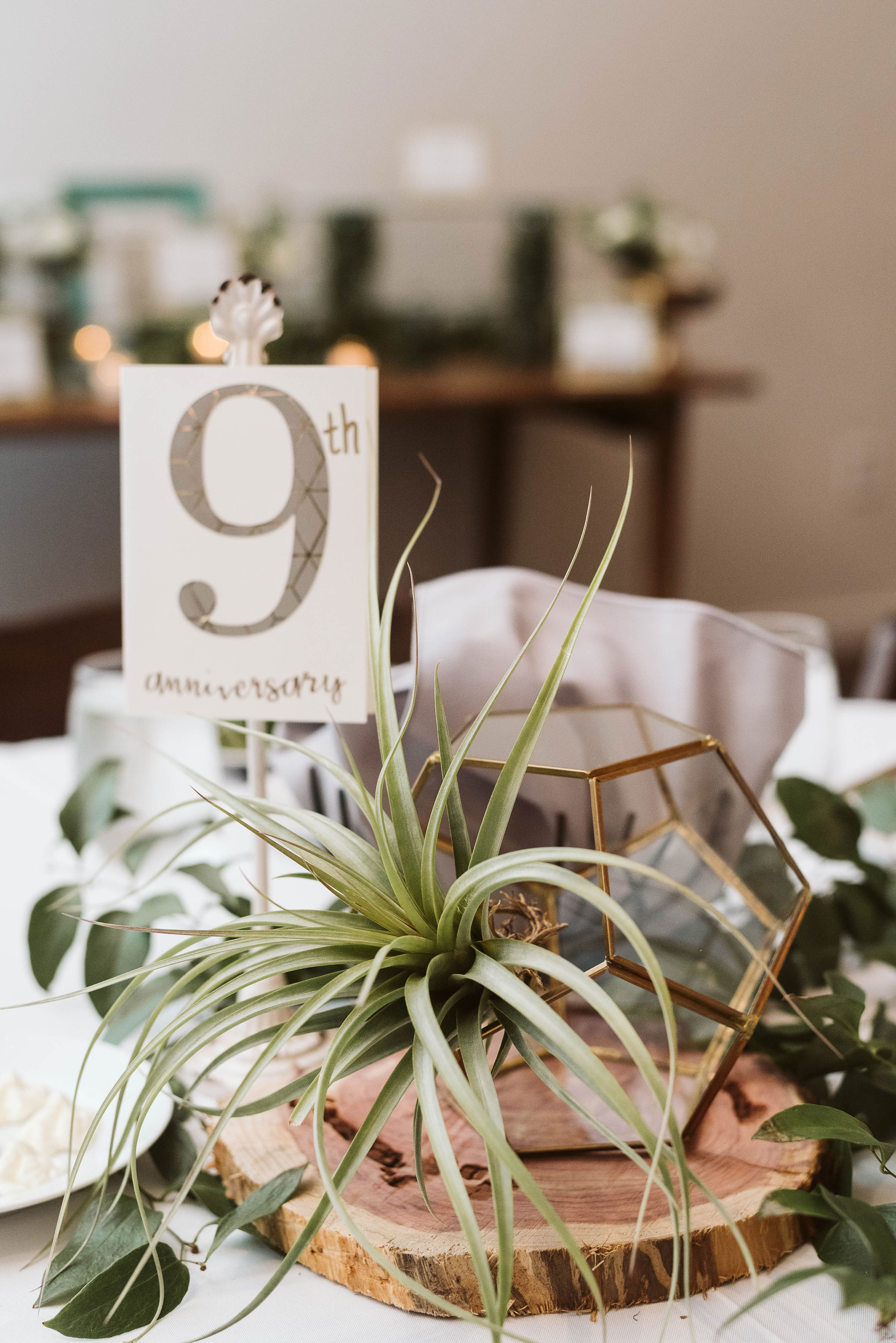 Gold geometric terrarium centerpiece with an air plant and greenery // Nashville, TN Wedding Florist