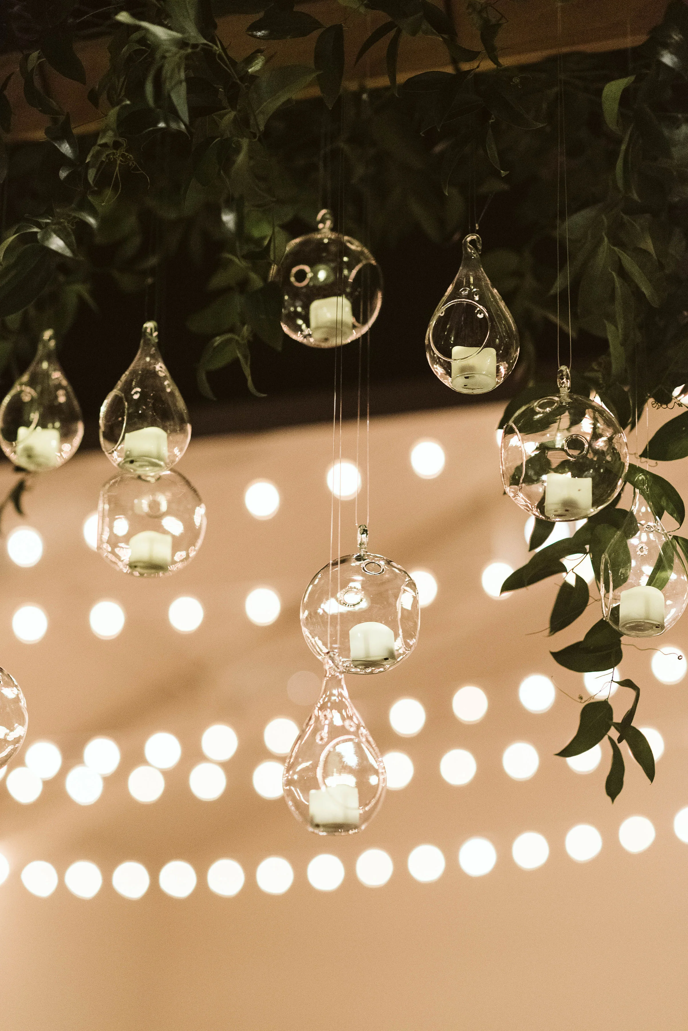 Hanging candle installation with untamed greenery // Tennessee Wedding Floral Design