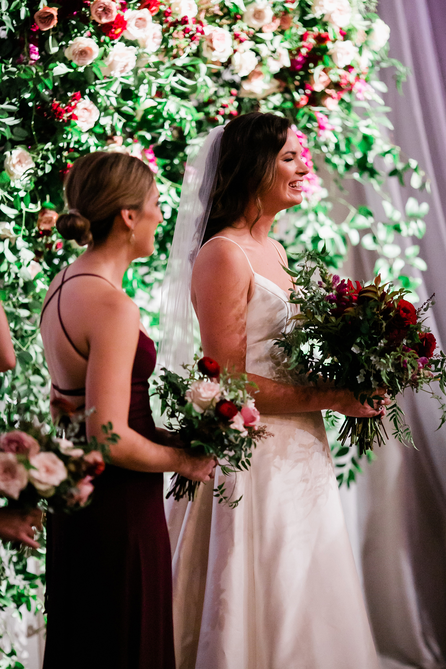 Flower wall for the wedding ceremony backdrop with lush greenery and burgundy and blush florals // Nashville Wedding Florist
