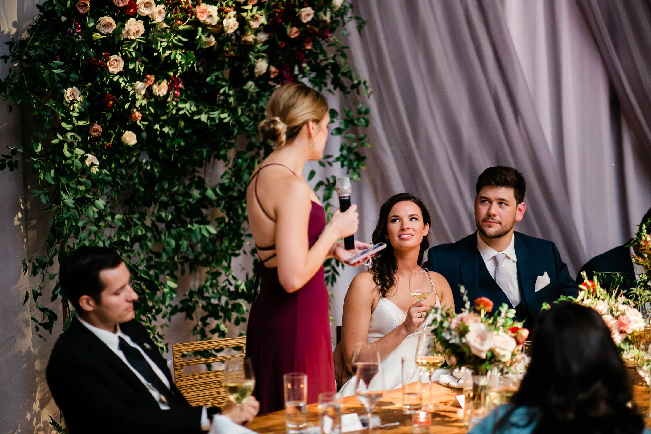 Flower wall for the head table backdrop with lush greenery and burgundy and blush florals // Nashville Wedding Florist
