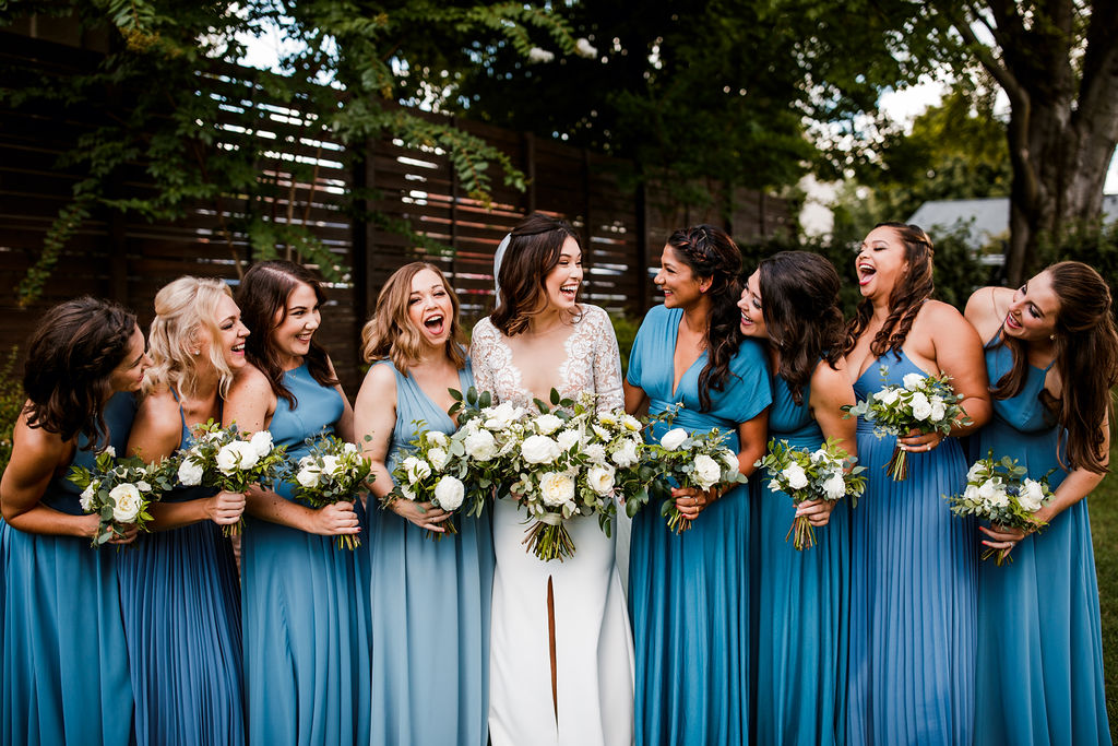 All white and greenery bouquets for bridesmaids in blue dress // Nashville Wedding Flowers