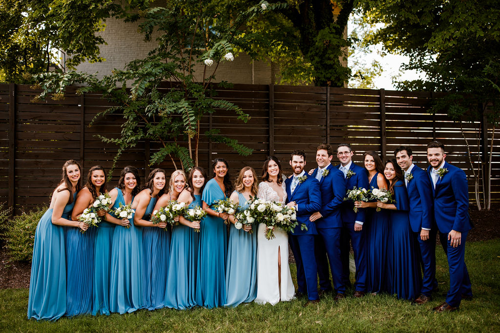 All white and greenery bouquets for bridesmaids in blue dress // Nashville Wedding Flowers