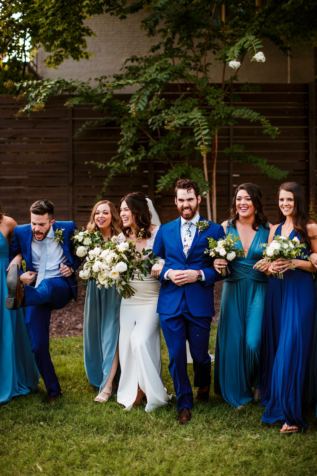 All white and greenery bouquets for bridesmaids in blue dress // Nashville Wedding Flowers