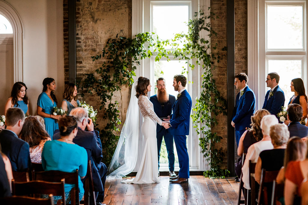 Vine-like greenery arch installation for the ceremony backdrop // Southern US Wedding Floral Designer