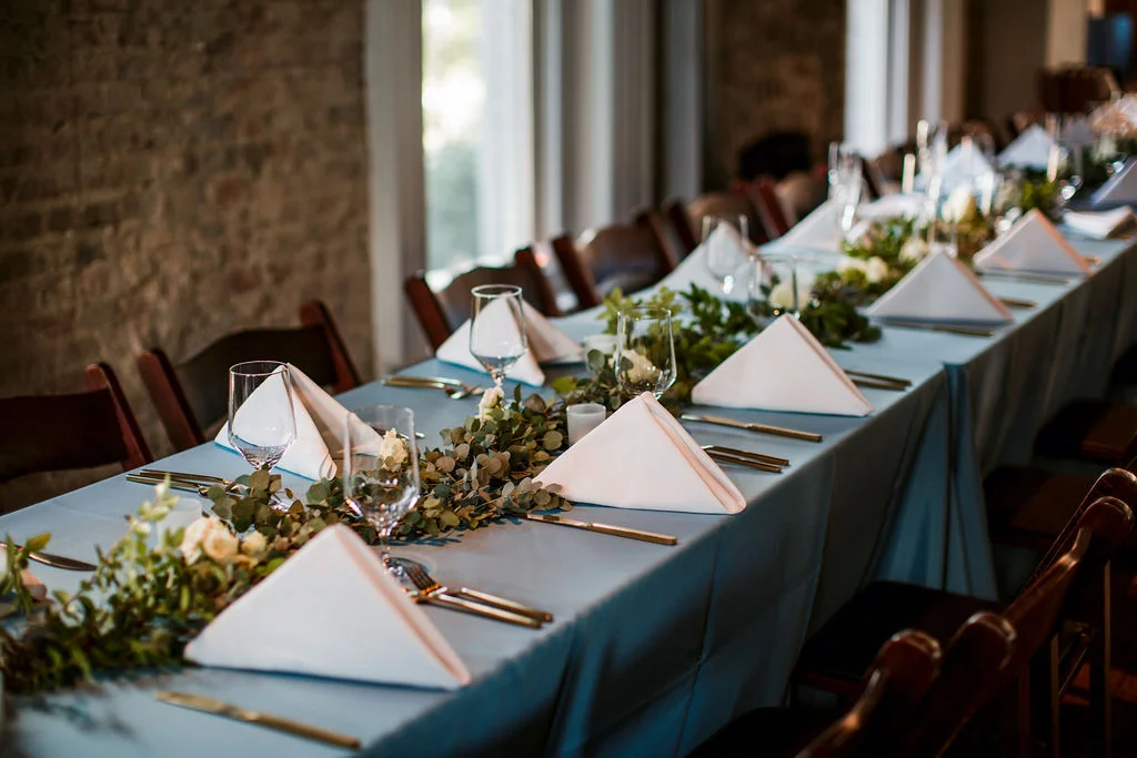 Eucalyptus garland table runners with floral accents of white and blush // TN Floral Designer