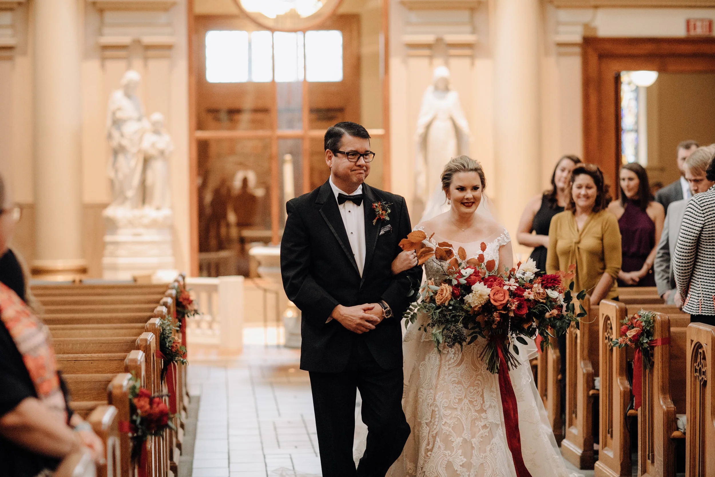 Lush bridal bouquet with autumn foliage, anemones, dahlias, and garden roses. Nashville Wedding Floral Design.