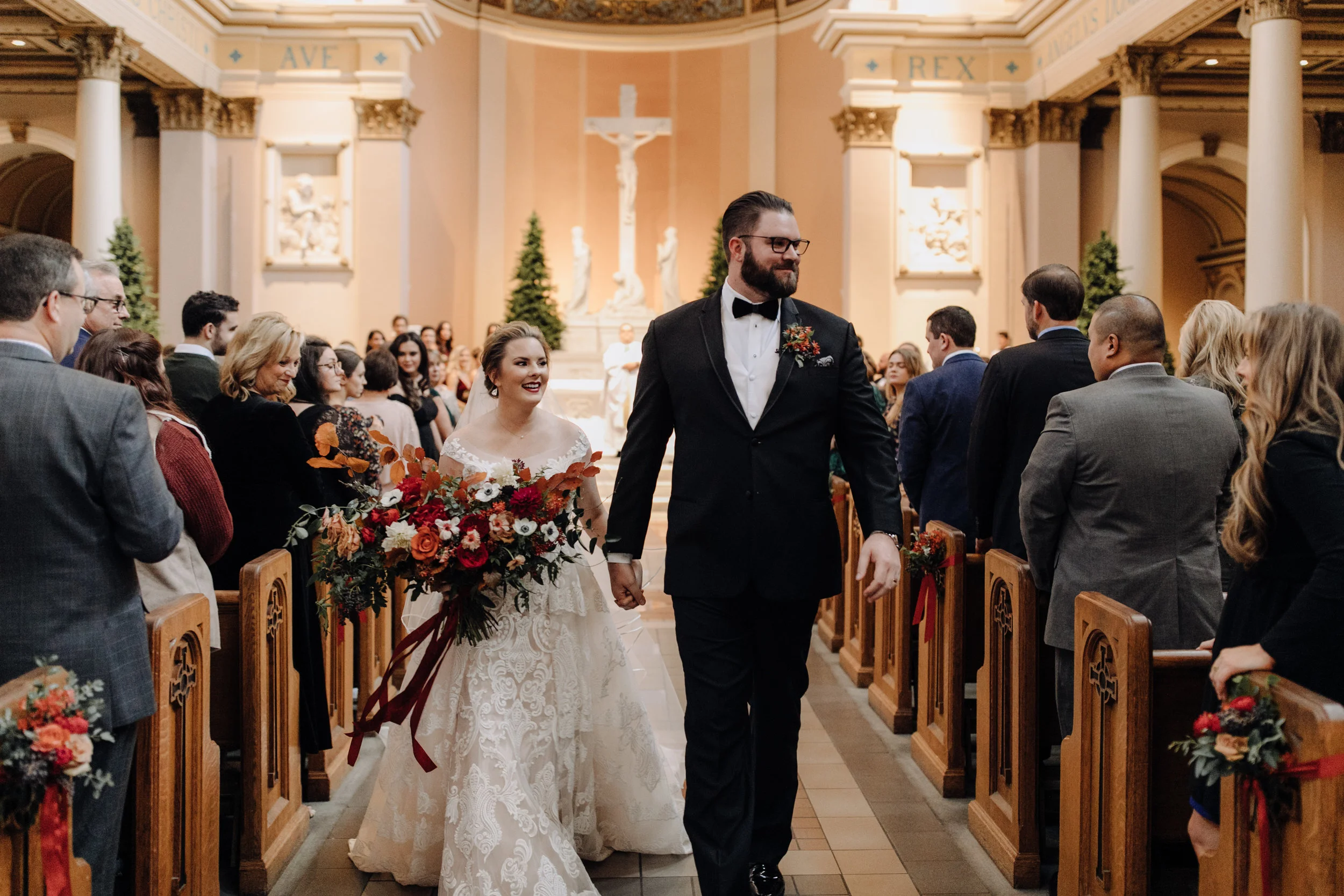 Burgundy velvet bridesmaid dresses with lush, asymmetrical bouquets using garden roses, ranunculus, and anemones. Nashville Wedding Floral Design at the Cathedral.