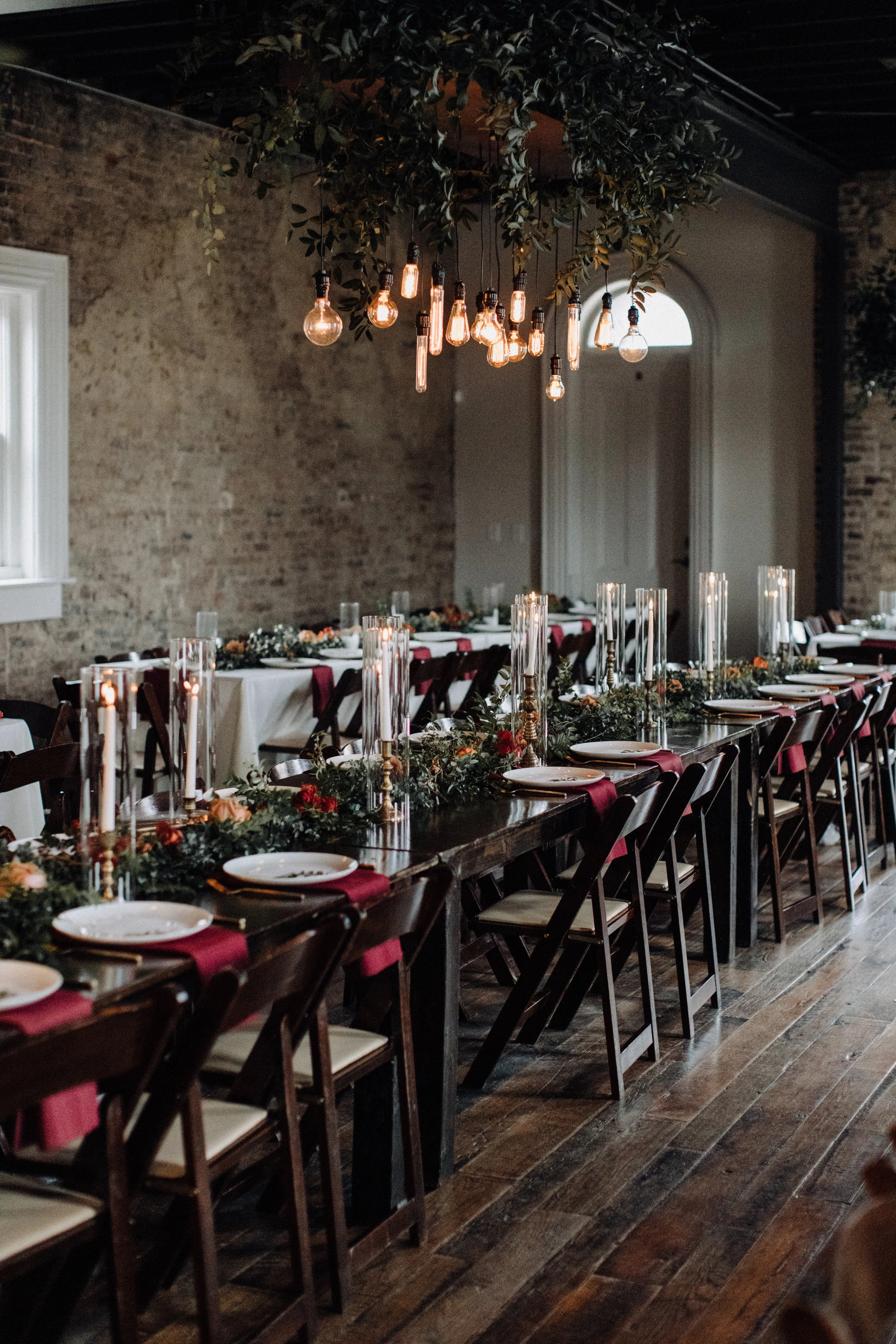 Fall wedding party style with deep reds and touches of burnt orange. Nashville Wedding Florist.  Autumnal bridesmaid bouquets with burgundy and soft orange and lots of greenery and berries. Tennessee Wedding Flowers.  Burgundy velvet bridesmaid dres…