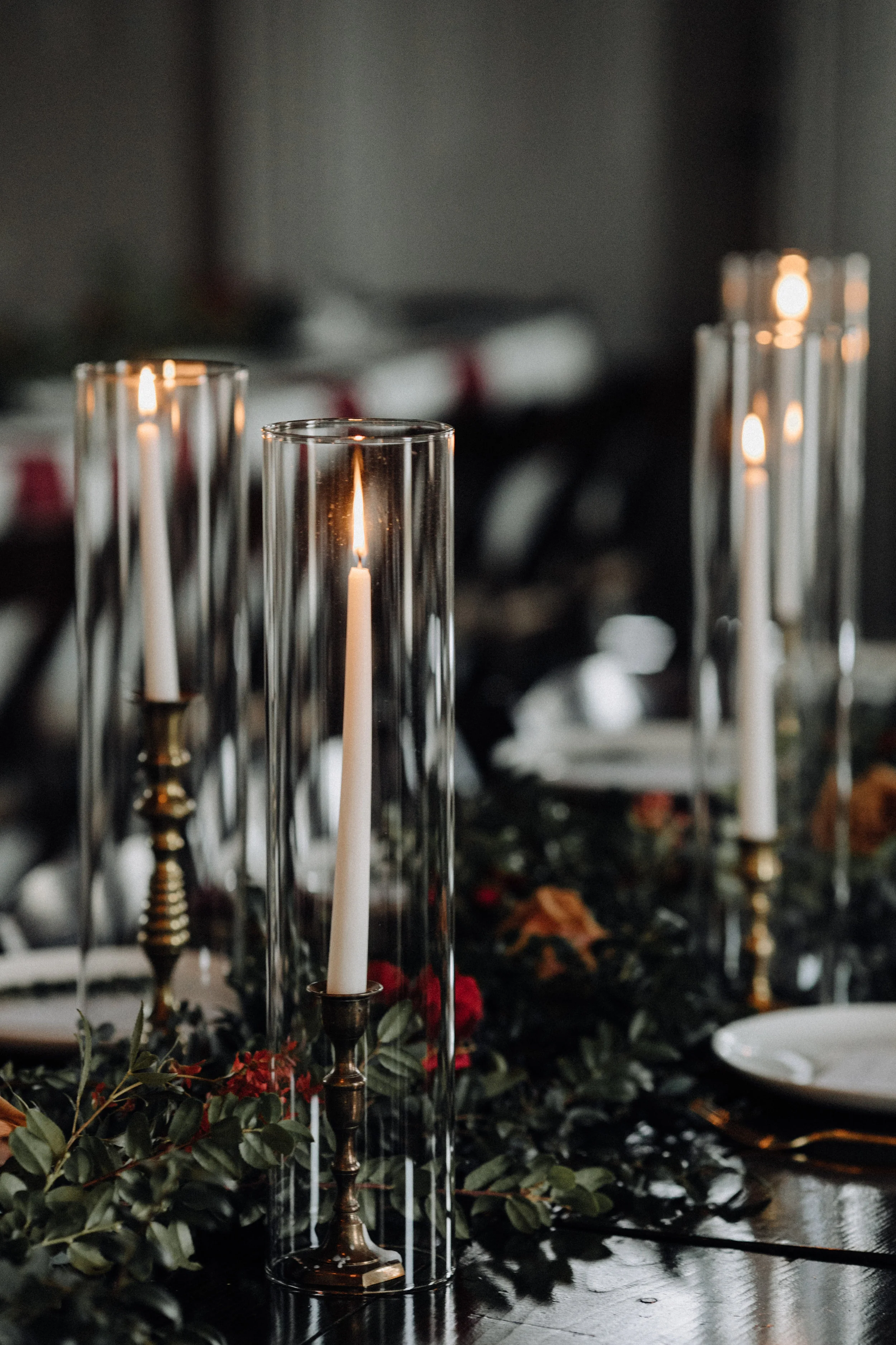 Garland table runner of eucalyptus and natural greenery with copper and burgundy floral accents. Garden-inspired wedding florals at the Cordelle, Nashville.