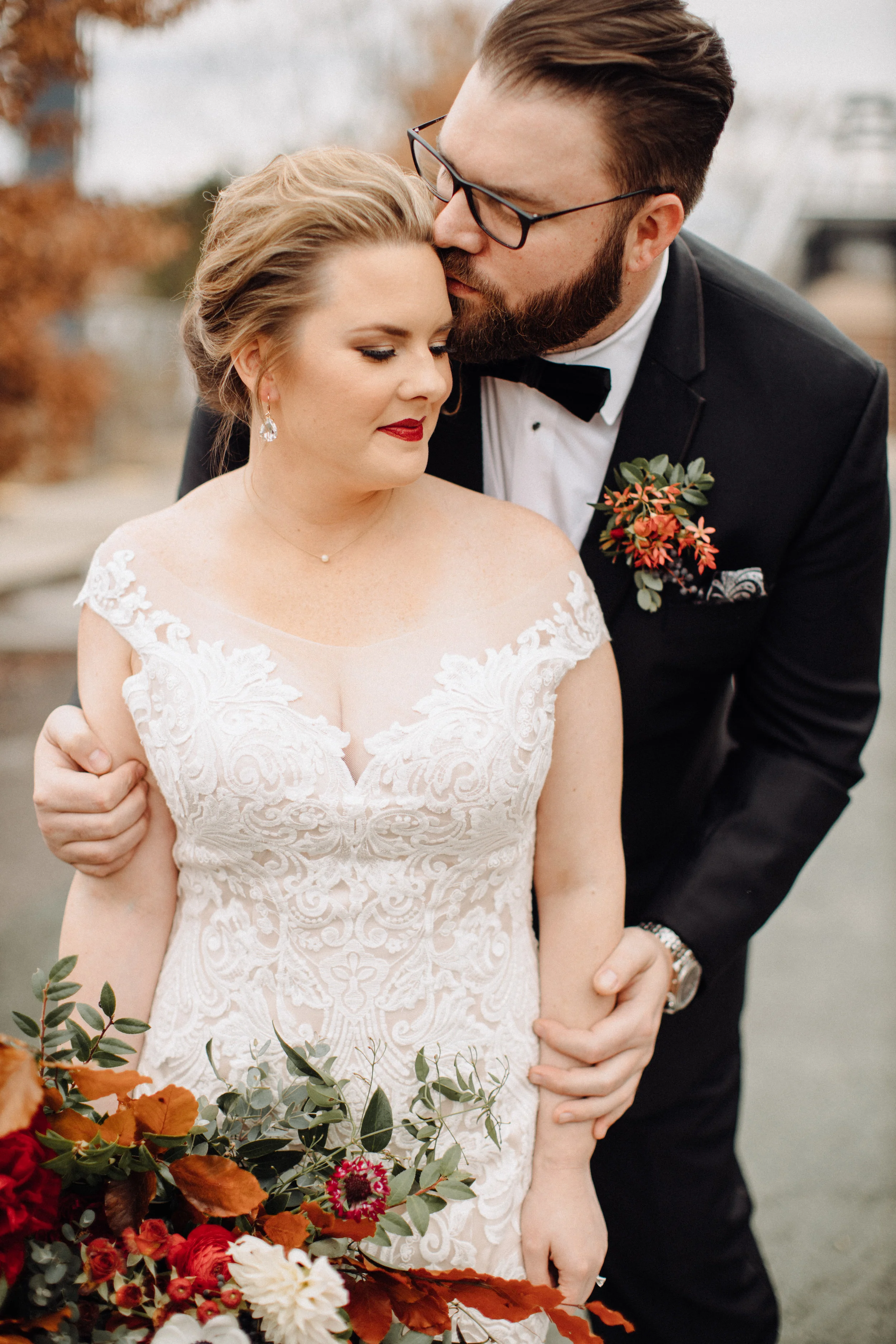 Lush bridal bouquet with autumn foliage, anemones, dahlias, and garden roses. Nashville Wedding Floral Design at the Cordelle.