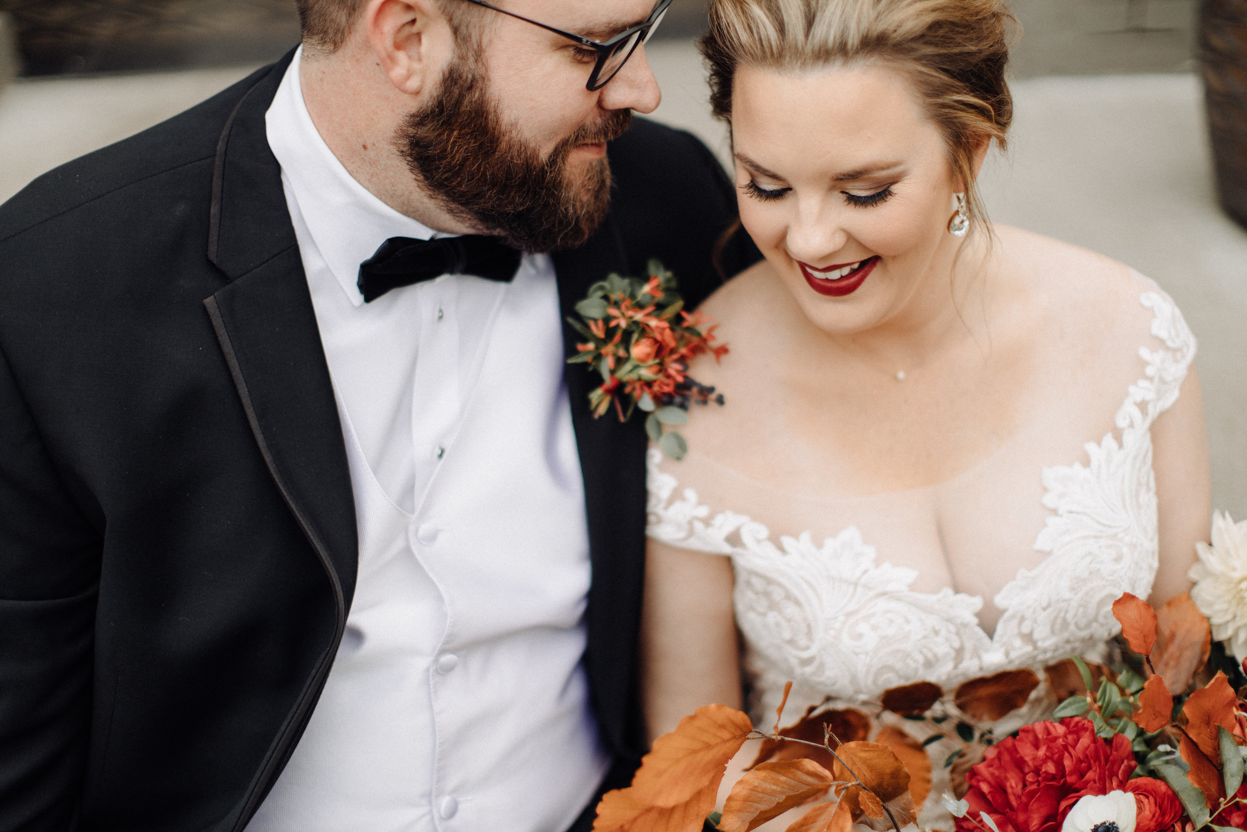 Autumnal groom boutonniere with berries, greenery, and texture. Southeastern US Wedding Floral Design.