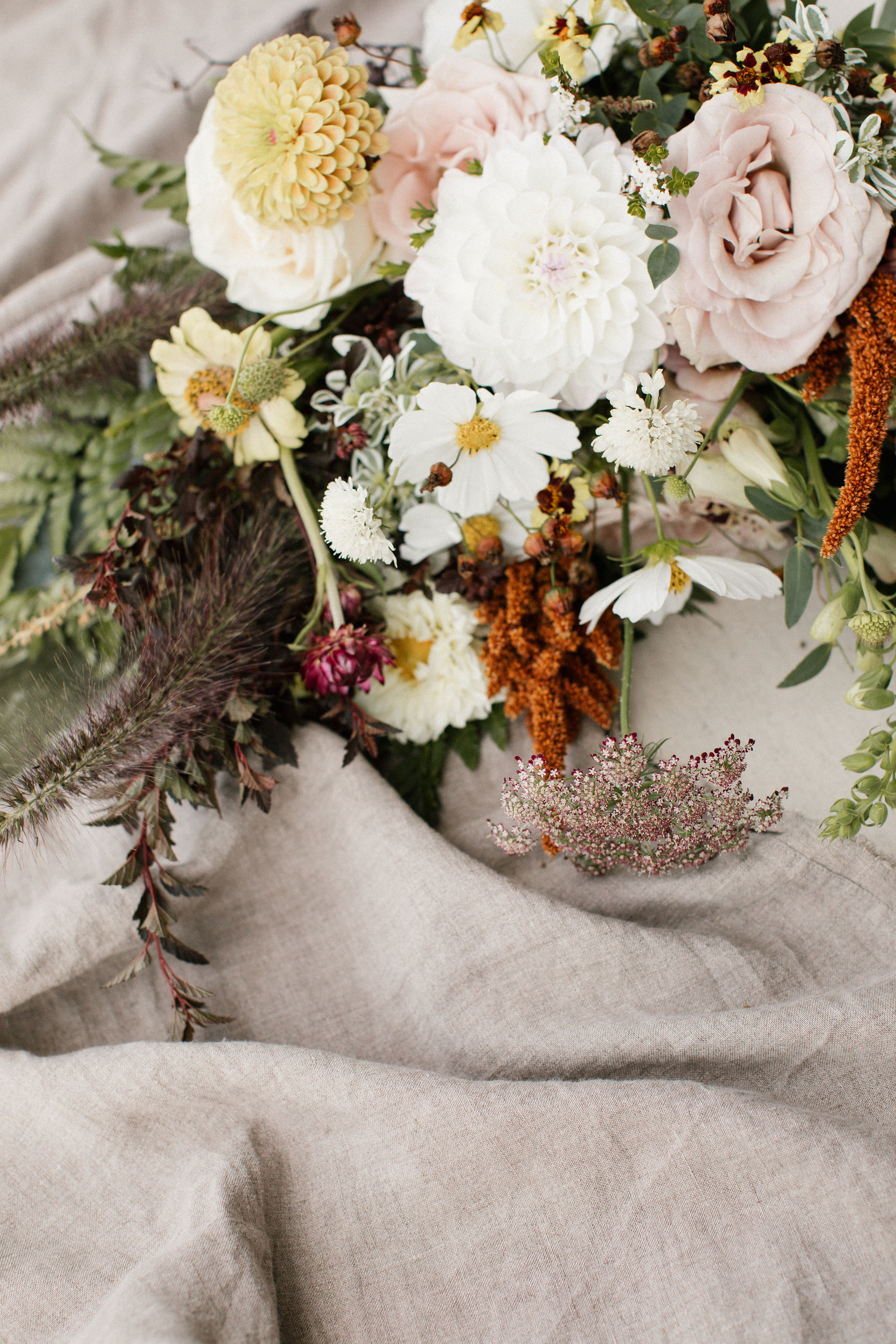 Natural, untamed bridal bouquet in neutral colors with sage green velvet ribbon. Nova Scotia Wedding Floral Design