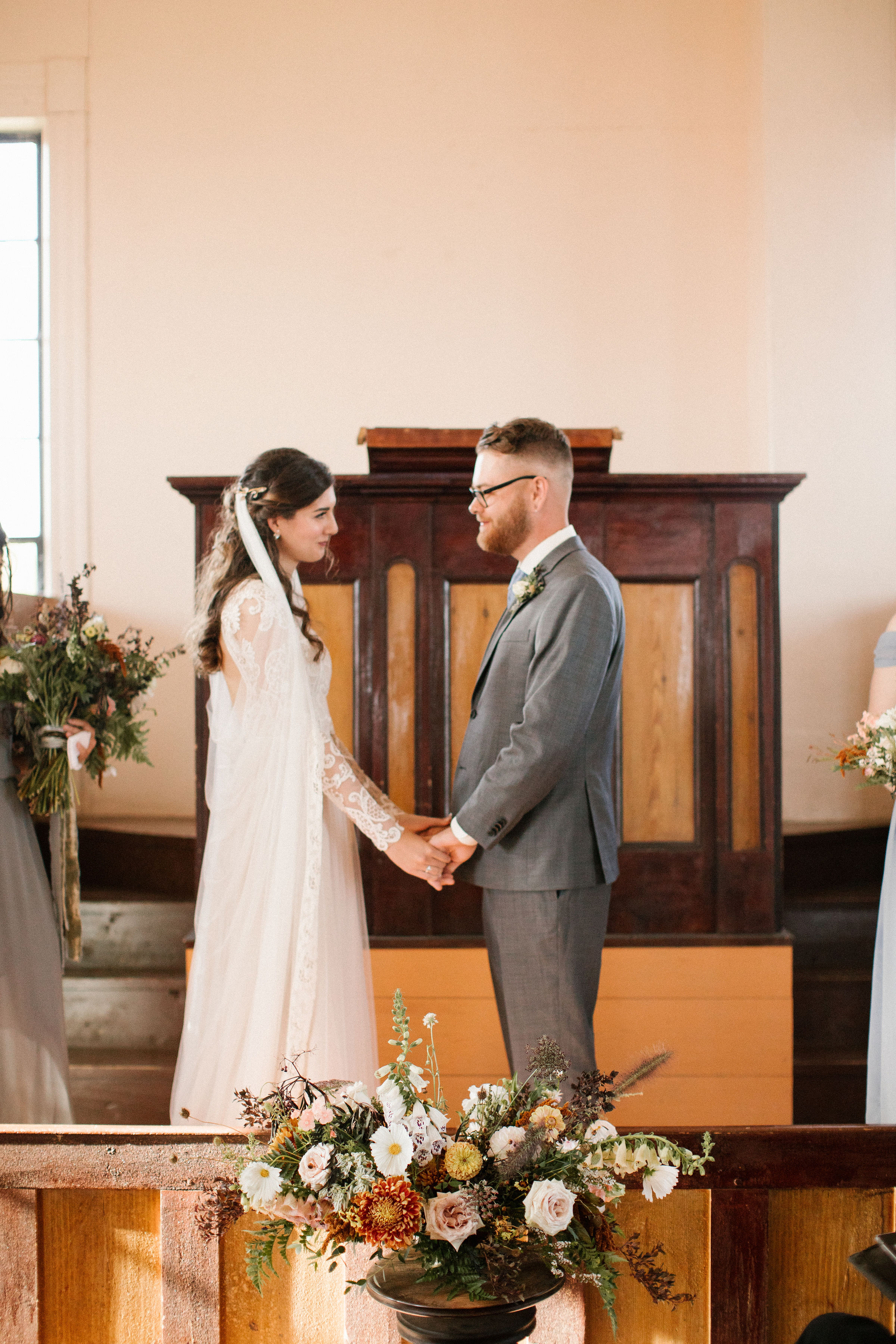 Wedding ceremony in a small chapel on Cape Breton. Lush Destination Wedding Floral Design