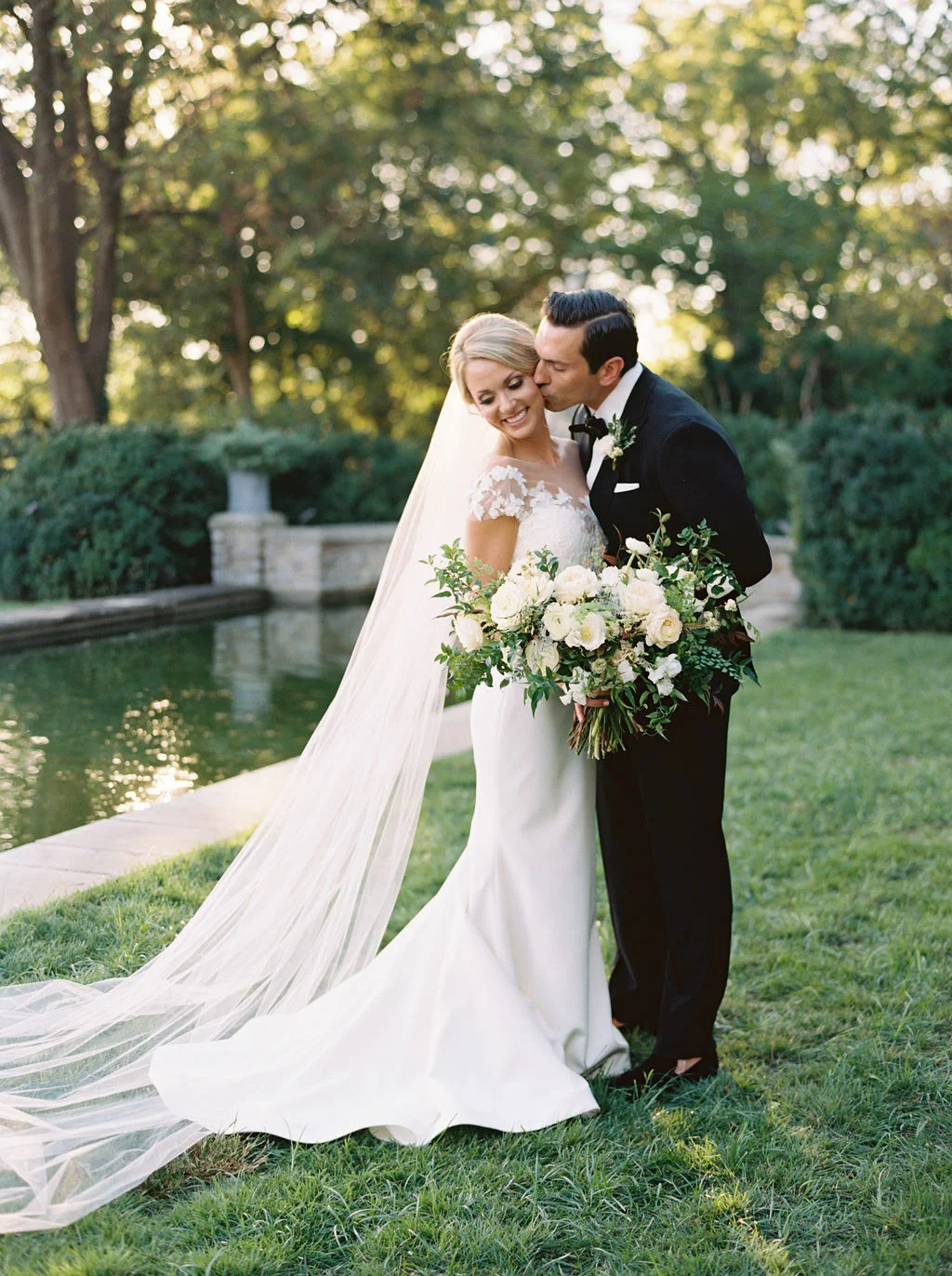 Botanic Garden Wedding with all white florals with lush greenery. Nashville Floral Designer.