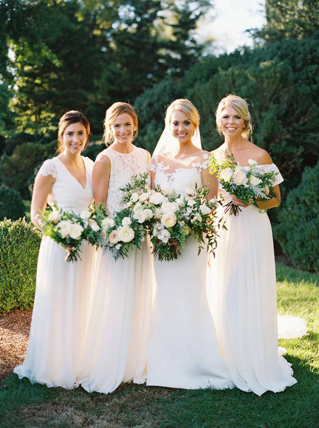 kristinsweeting_3RG_familyparty-0113.jpgAll white bridesmaid dresses with white flowers and greenery. Nashville Wedding Floral Design.