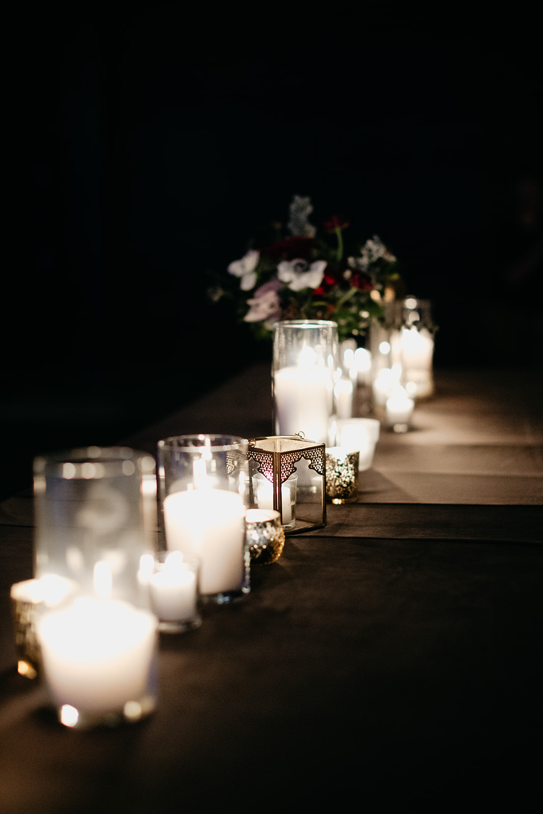 Candlelit wedding reception with marsala and burgundy florals. Real January Wedding at Marathon Music Works!