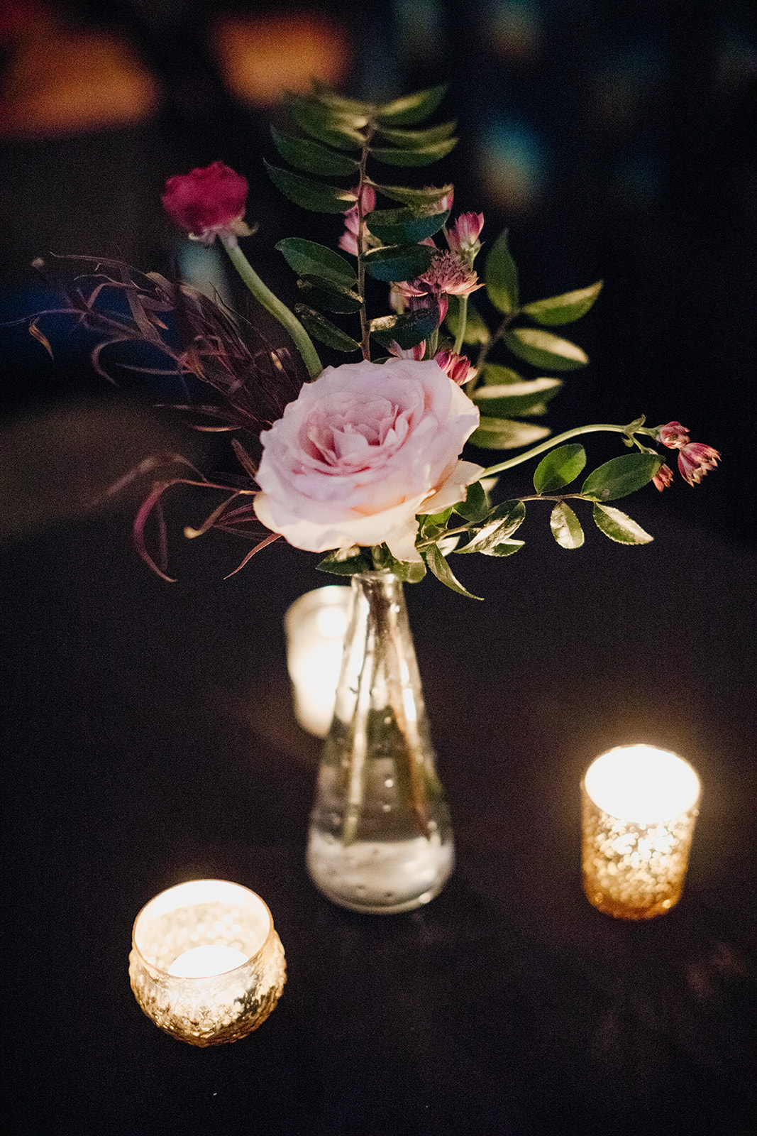 Candlelit wedding reception with marsala and burgundy florals. Real January Wedding at Marathon Music Works in Nashville, TN!
