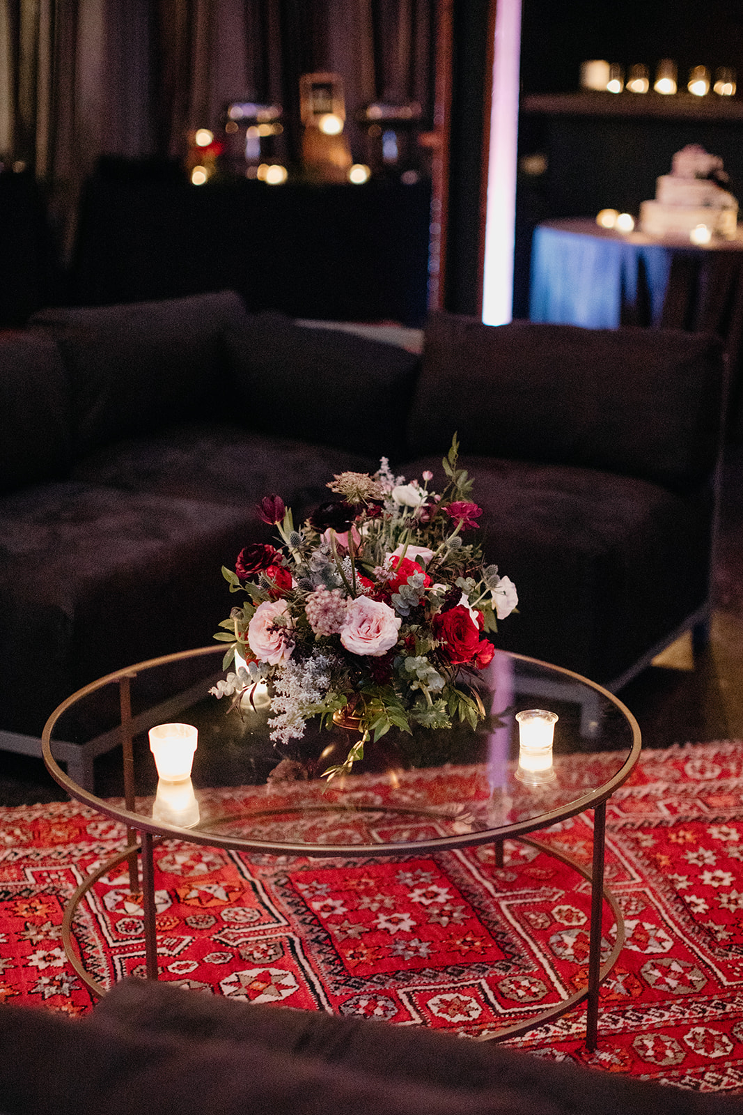 Persian rugs and lush, asymmetrical floral design for a Marathon Music Works wedding in Nashville.