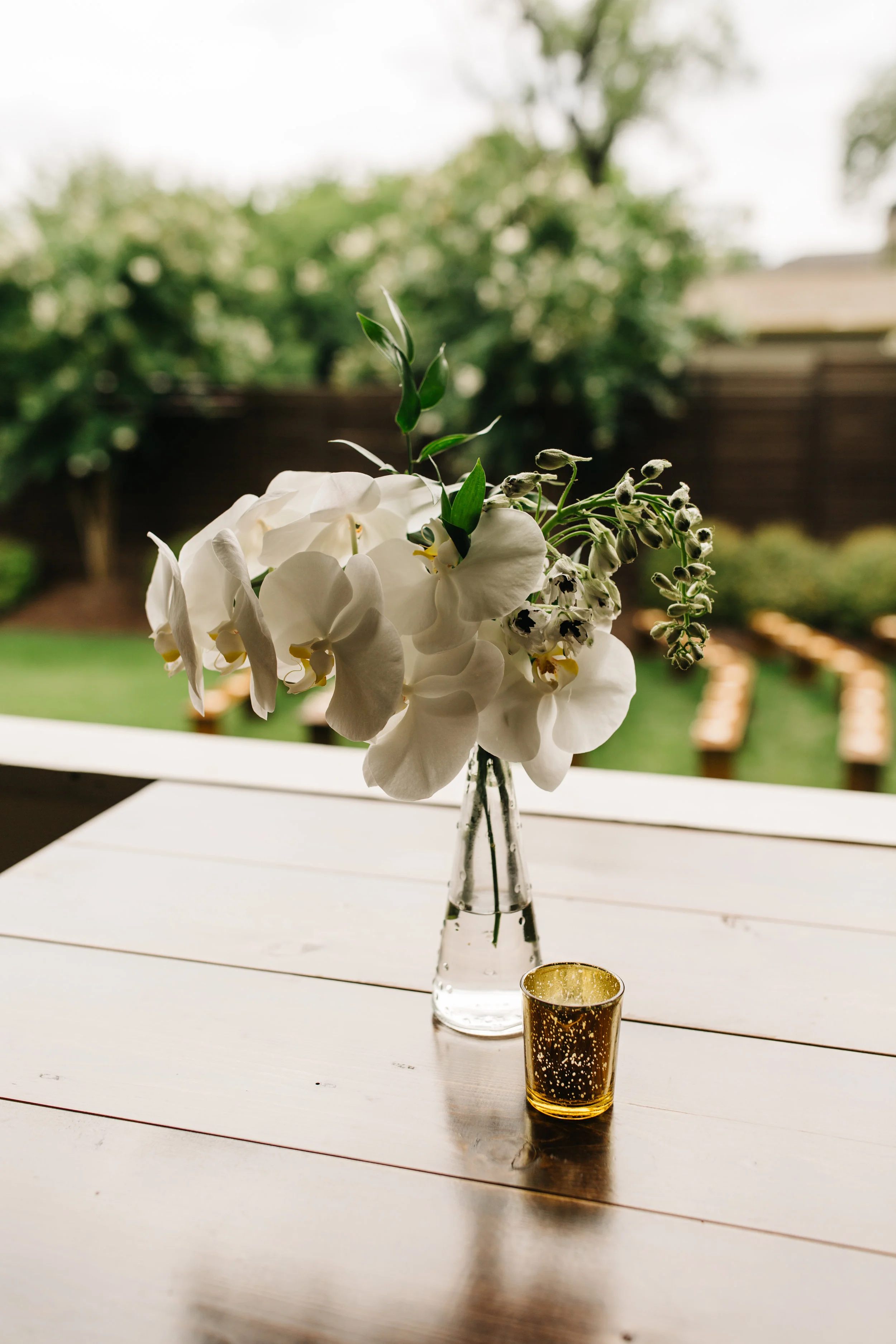 All white floral design with organic, asymmetrical style for a wedding at the Cordelle in Nashville.