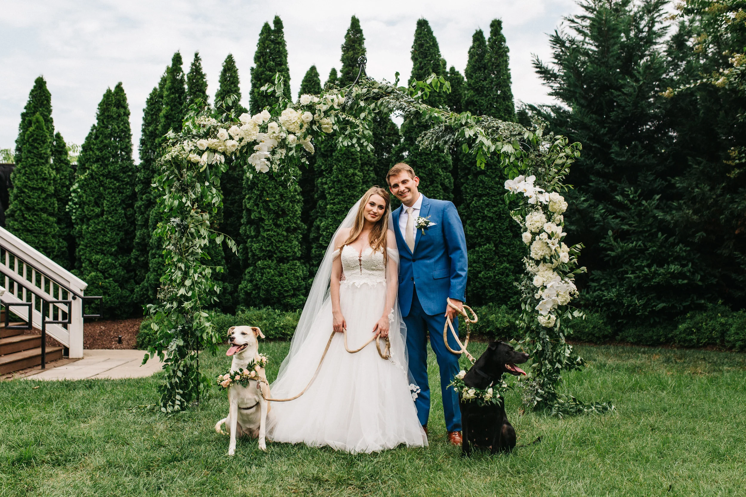 Flower dogs with floral collars! Organic, trailing floral design for a Nashville wedding.