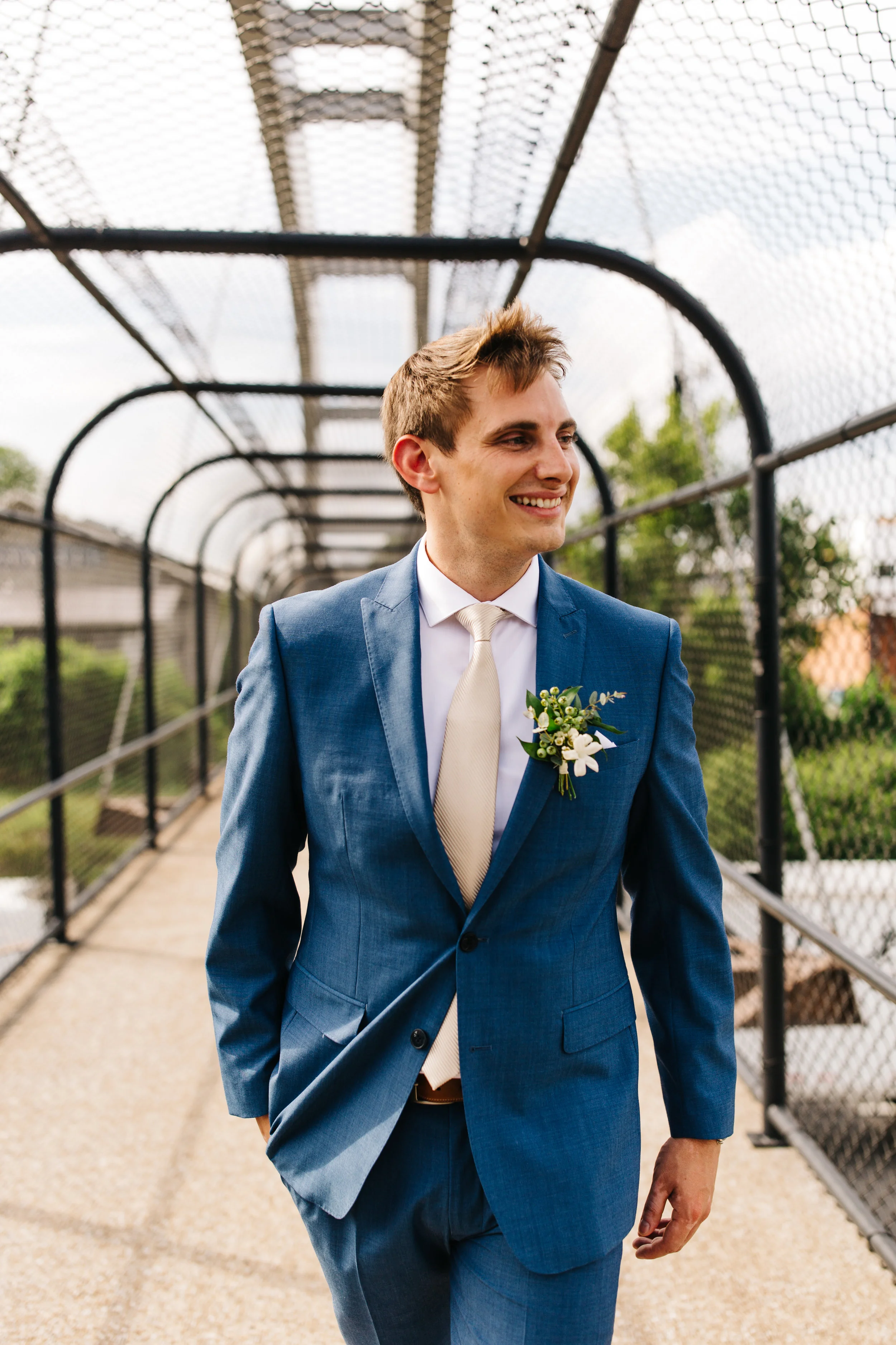White stephanotis boutonniere with greenery and texture for the groom. Nashville Wedding Flowers.