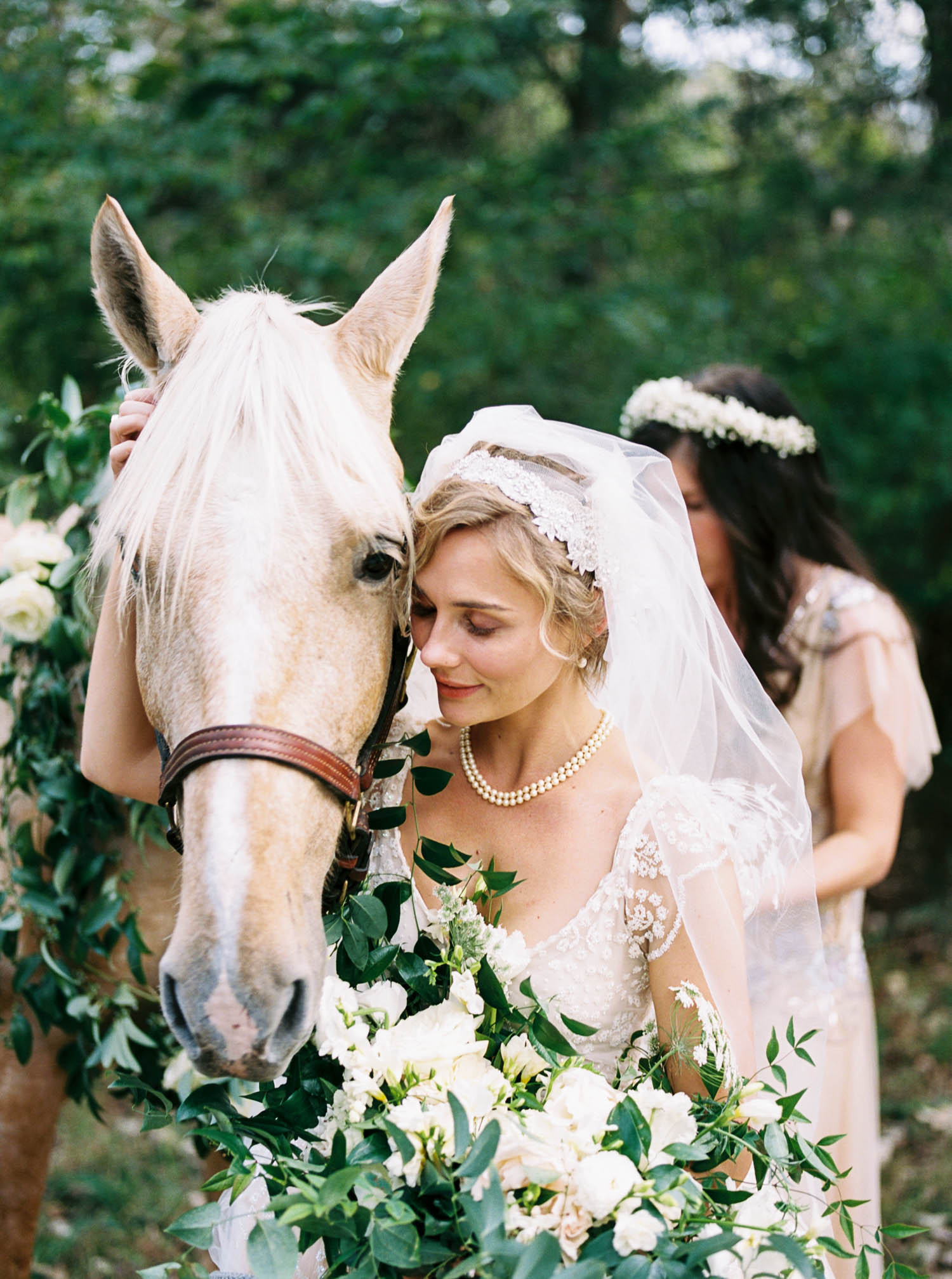 Lush bridal bouquet and floral garland for horse. Nashville Wedding Florist.