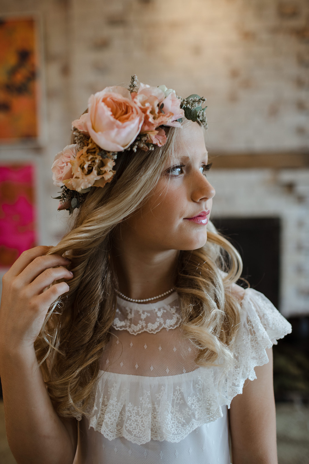 Oversized flower girl crown with peach garden roses and ranunculus.