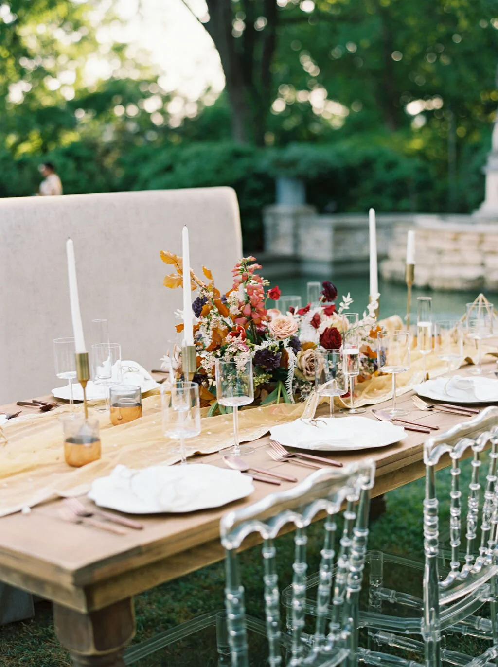 Low centerpiece with a mauve, rust, and burgundy color palette for an Indian wedding at Cheekwood Botanical Gardens. Nashville Wedding Florist.