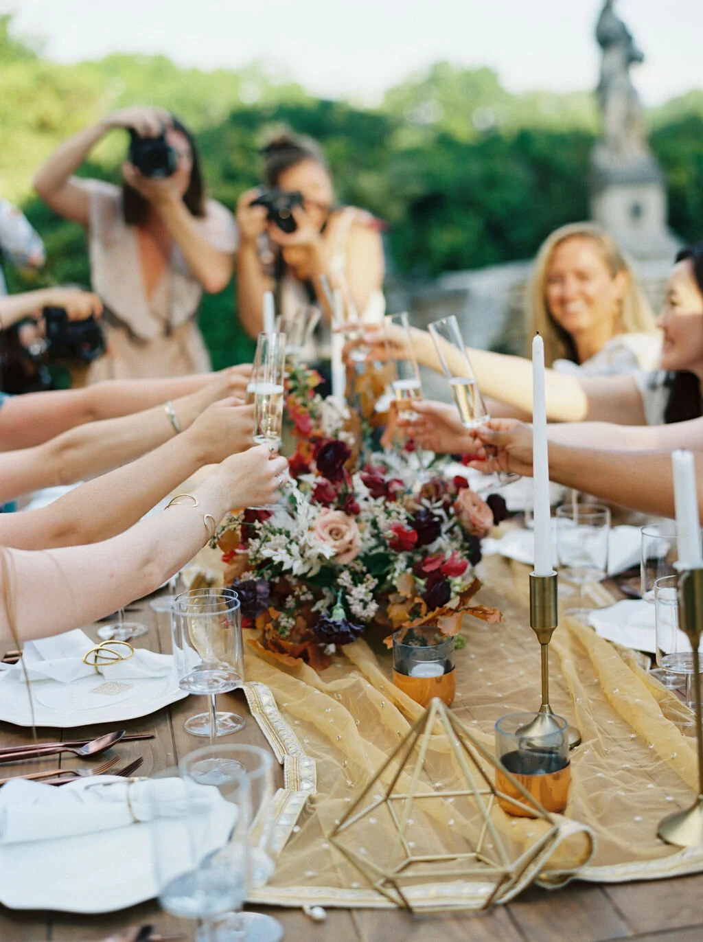 Low centerpiece with a mauve, rust, and burgundy color palette for an Indian wedding at Cheekwood Botanical Gardens. Nashville Wedding Florist.