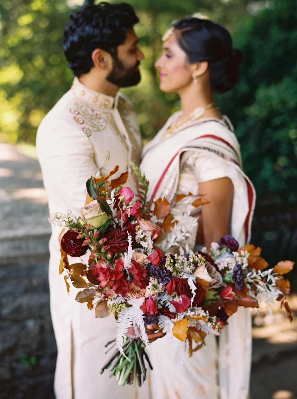 Copper, mauve, and marsala Indian bridal bouquet with white ferns, garden roses, sweet peas, and tulips. Nashville Wedding Floral Design.