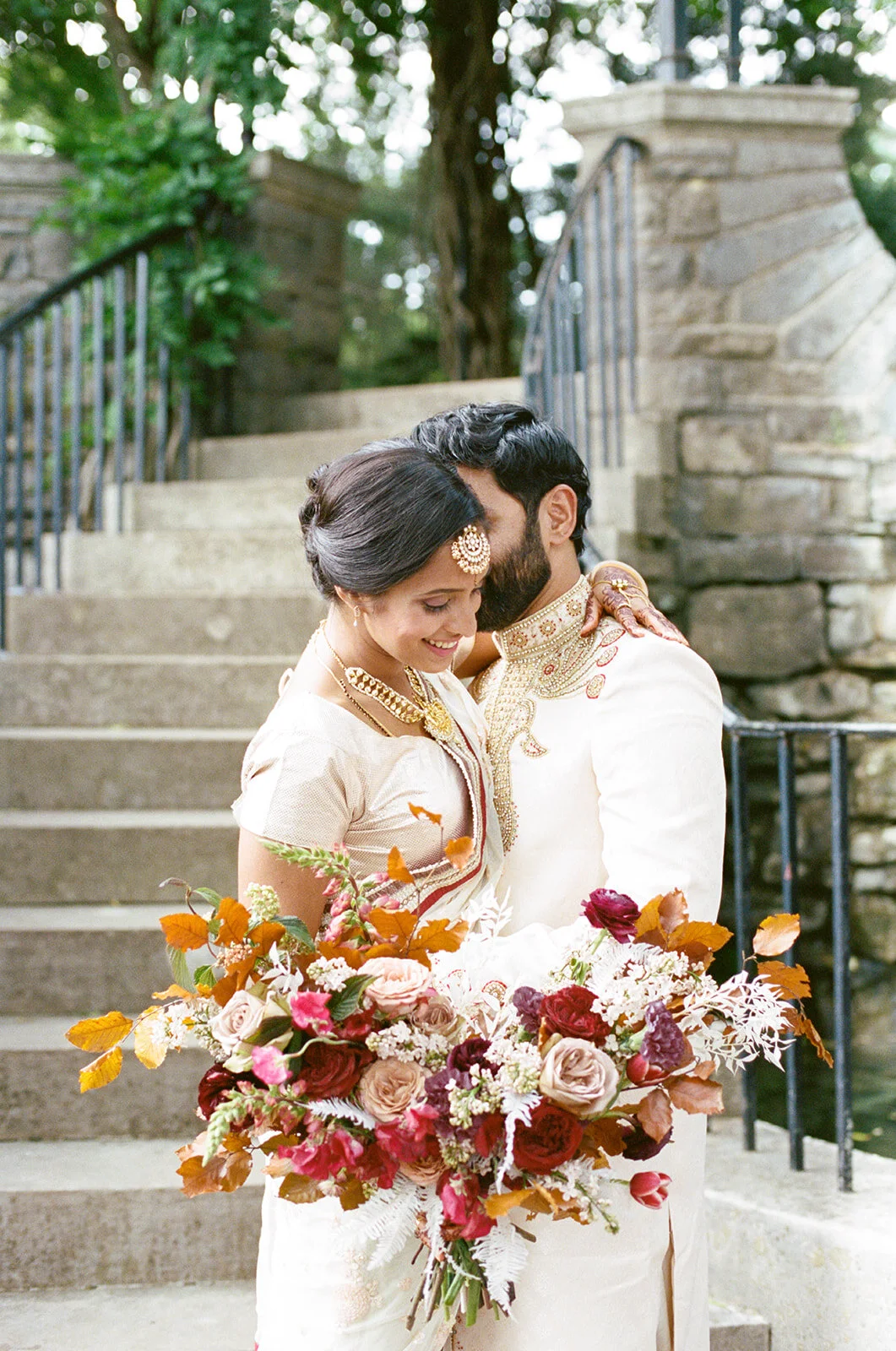 Copper, mauve, and marsala Indian bridal bouquet with white ferns, garden roses, sweet peas, and tulips. Nashville Wedding Floral Design.