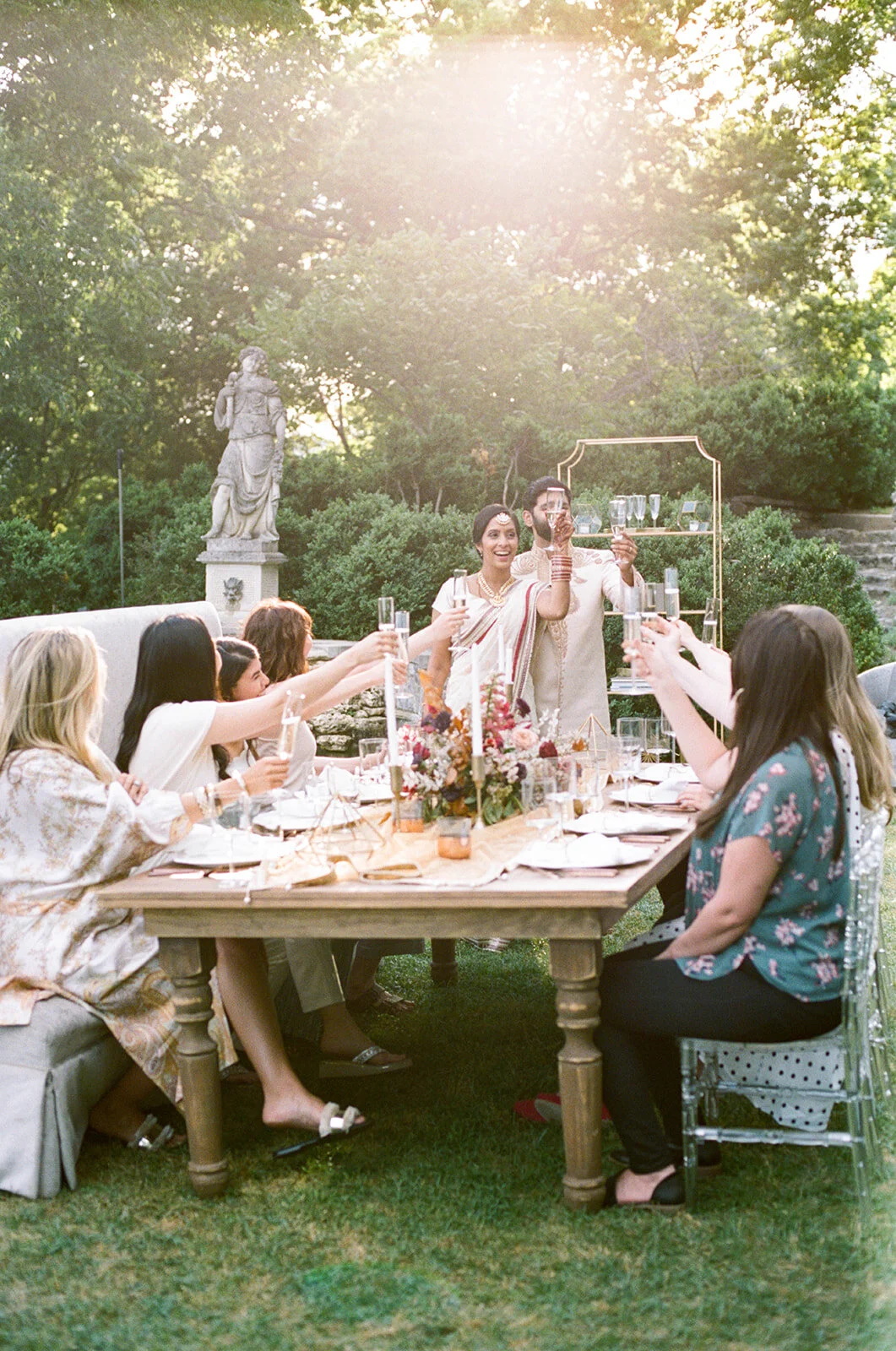 Low centerpiece with a mauve, rust, and burgundy color palette for an Indian wedding at Cheekwood Botanical Gardens. Nashville Wedding Florist.