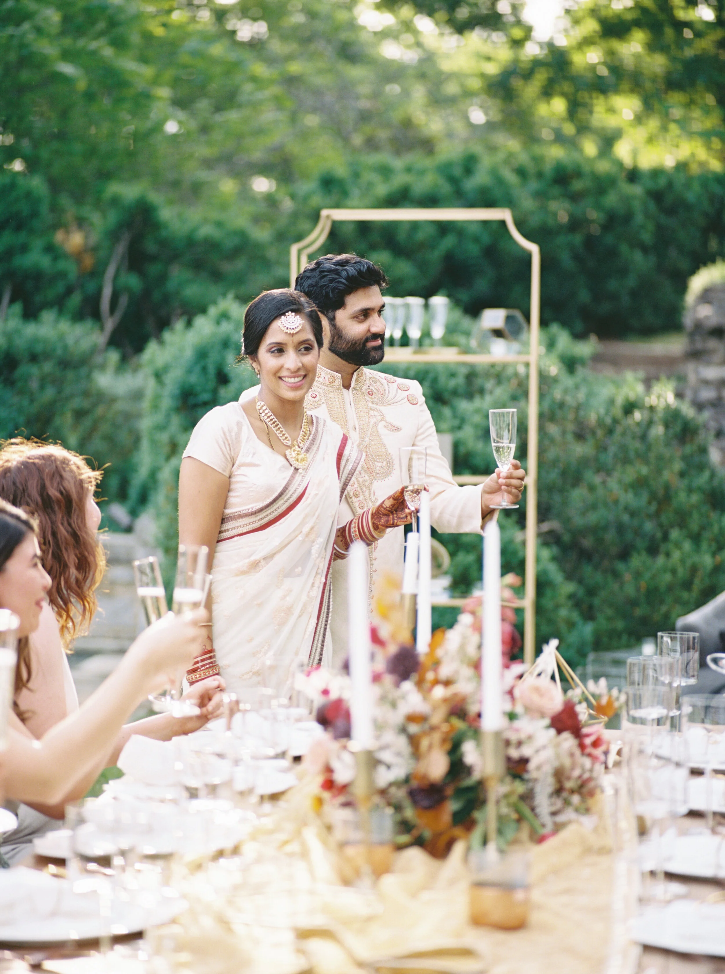 Low centerpiece with a mauve, rust, and burgundy color palette for an Indian wedding at Cheekwood Botanical Gardens. Nashville Wedding Florist.