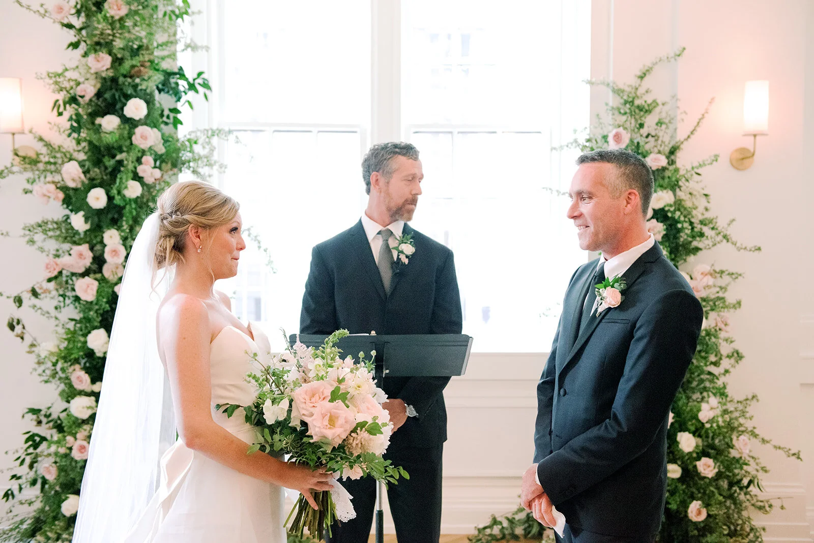 Asymmetrical floral installation growing up either side of the windows in the Noelle. Nashville Wedding Florist.
