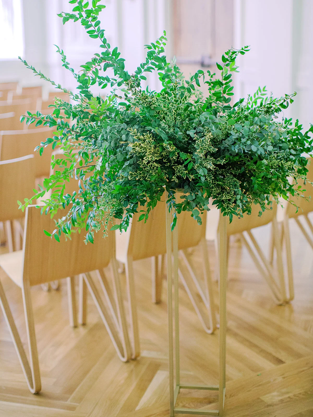 All greenery organic arrangement on a modern gold stand. Nashville wedding florist.