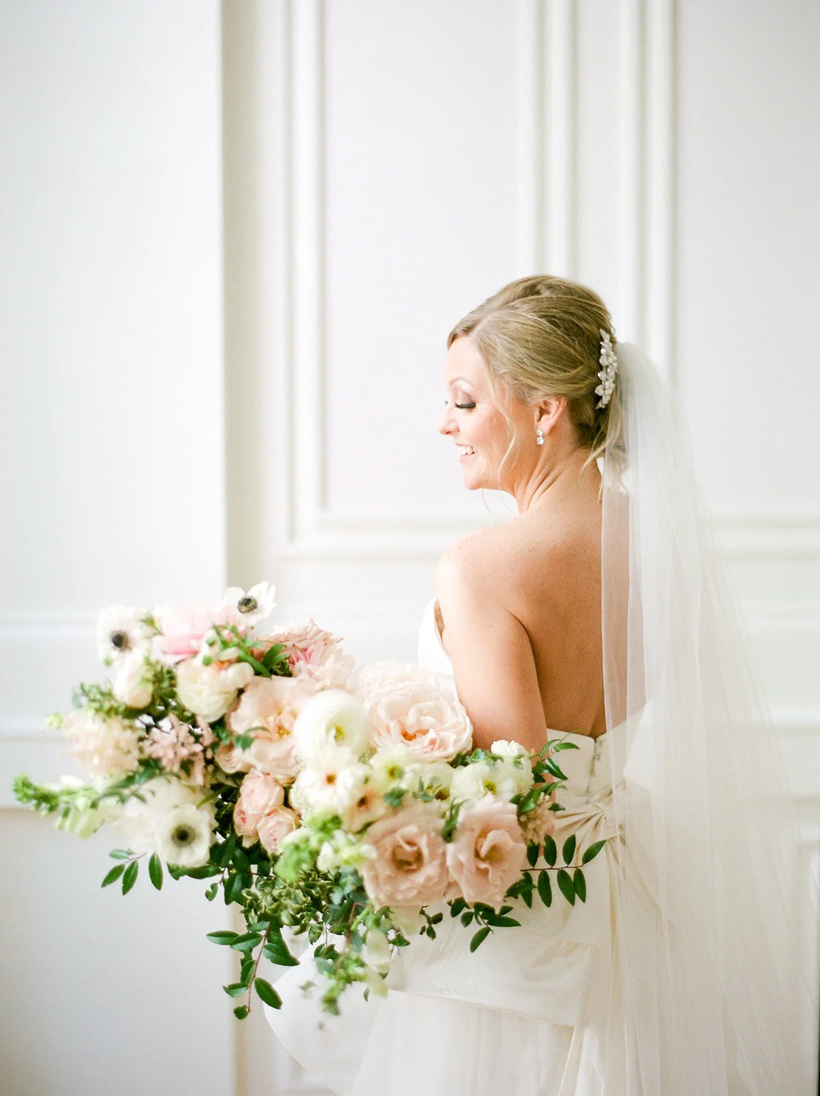 Garden-inspired bride’s bouquet with blush and white color palette including lots of lush, untamed greenery. Nashville wedding floral designer, Rosemary and Finch.