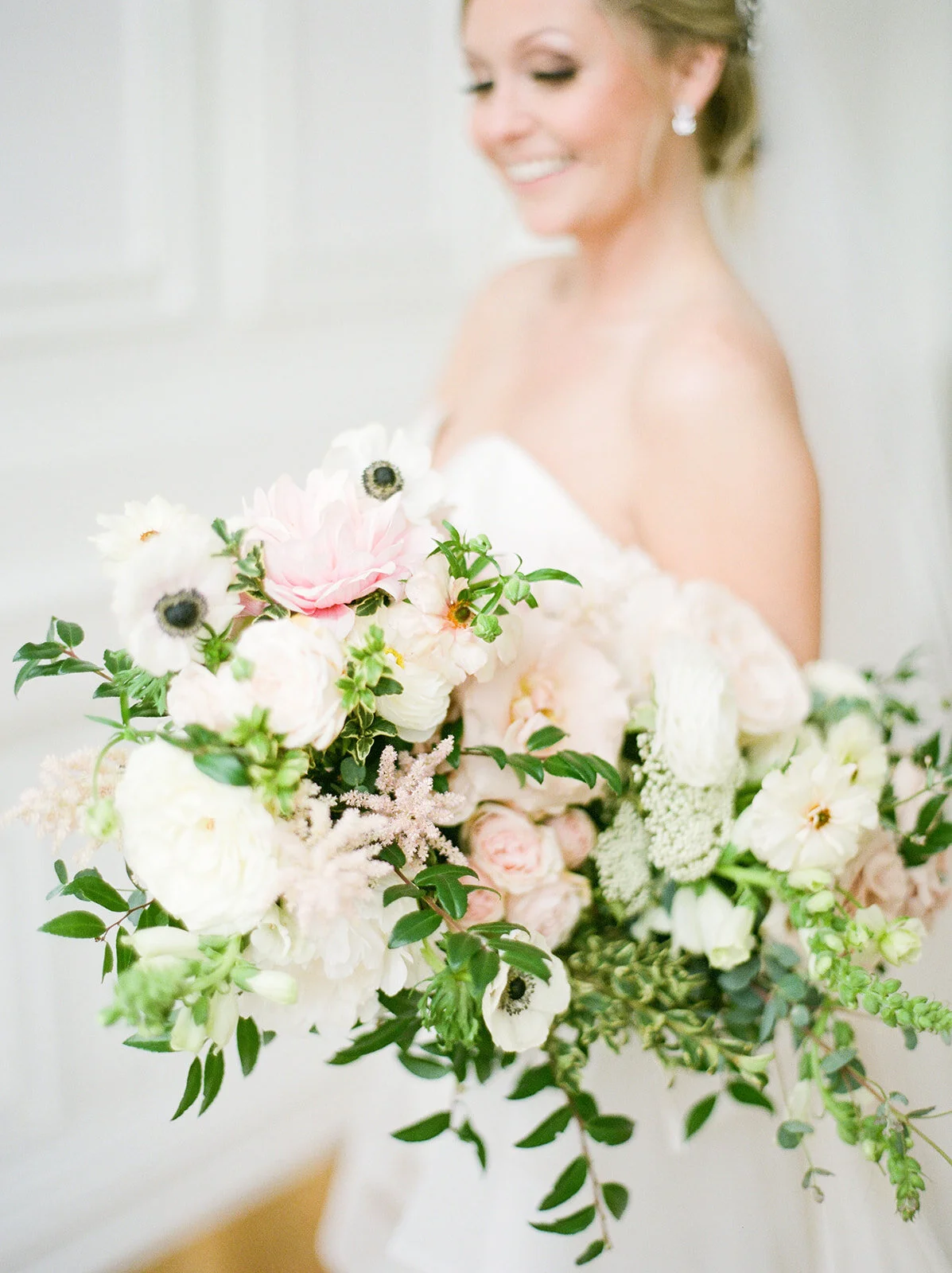 Garden-inspired bride’s bouquet with blush and white color palette including lots of lush, untamed greenery. Nashville wedding floral designer, Rosemary and Finch.