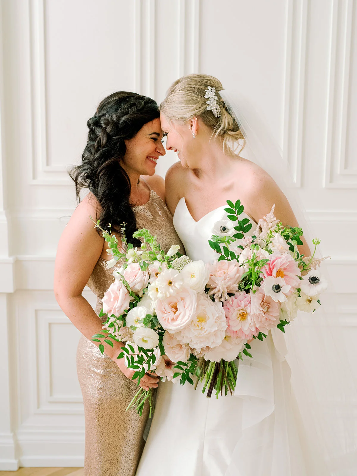 Garden-inspired bride’s bouquet with blush and white color palette including lots of lush, untamed greenery. Nashville wedding floral designer, Rosemary and Finch.