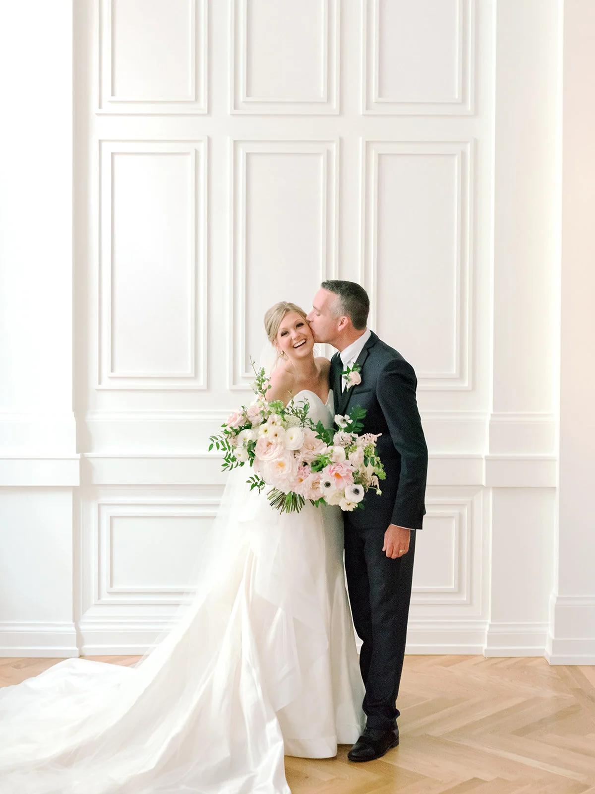 Blush, ivory, and greenery bridal bouquet with dahlias, garden roses, peonies, and anemones. Nashville wedding florist, Rosemary and Finch.