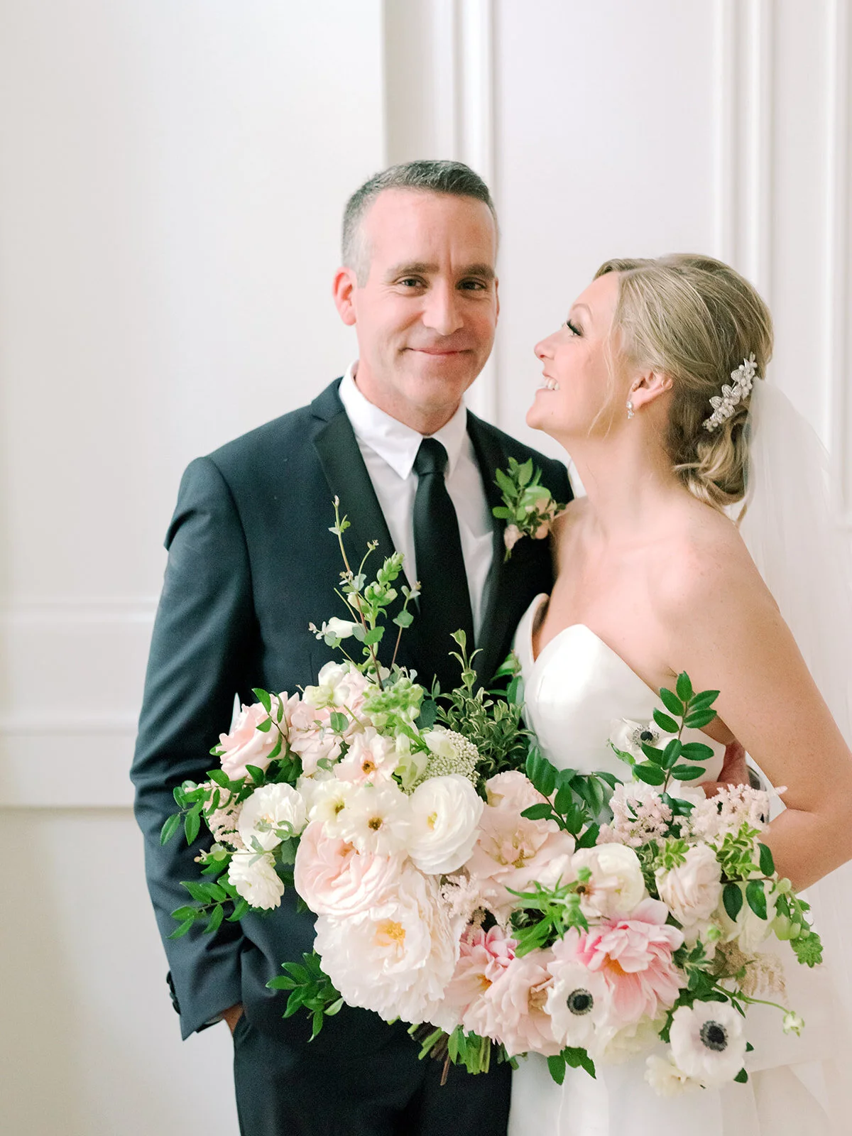 Blush, ivory, and greenery bridal bouquet with dahlias, garden roses, peonies, and anemones. Nashville wedding florist, Rosemary and Finch.