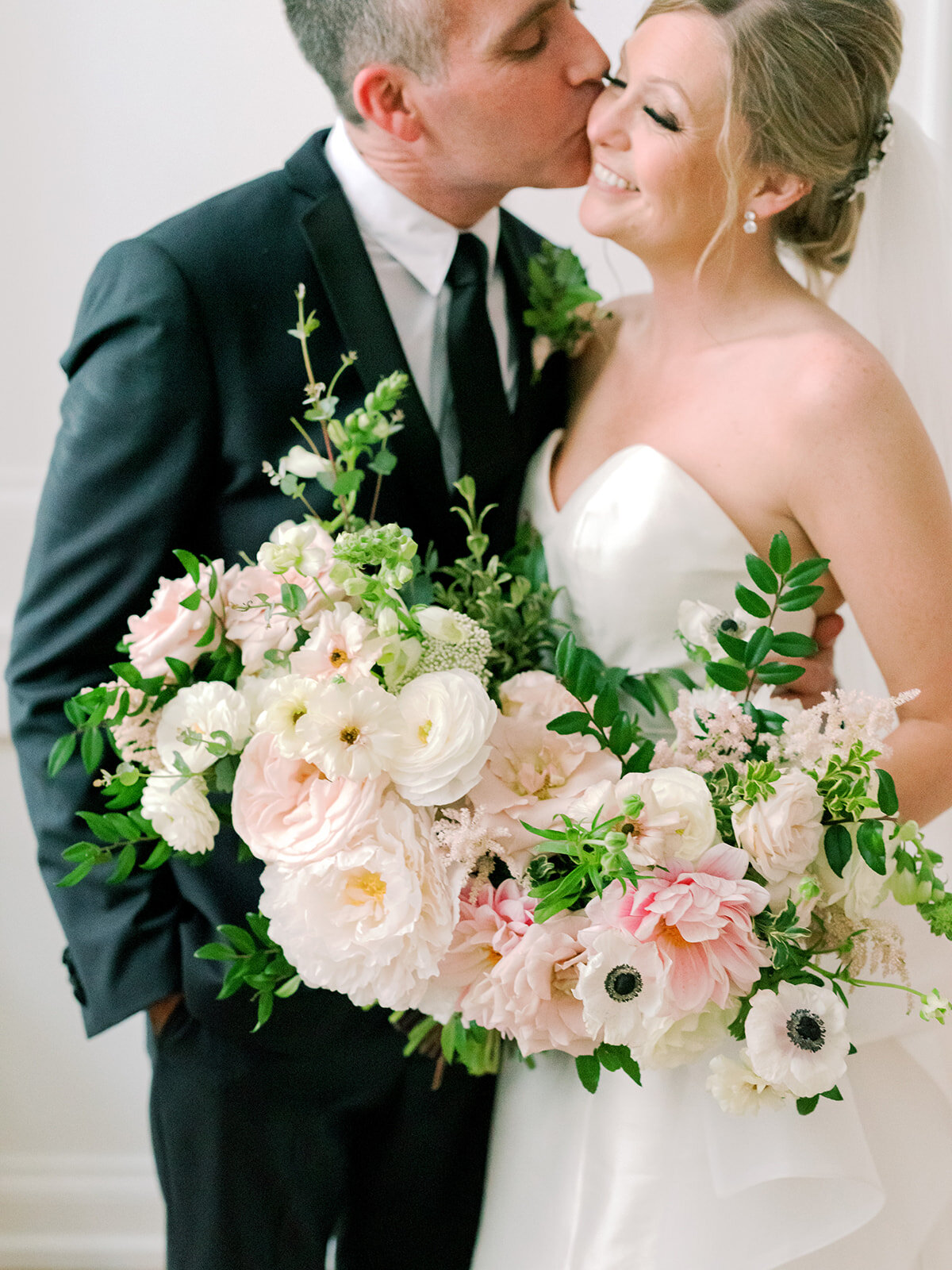 Garden-inspired bride’s bouquet with blush and white color palette including lots of lush, untamed greenery. Nashville wedding floral designer, Rosemary and Finch.