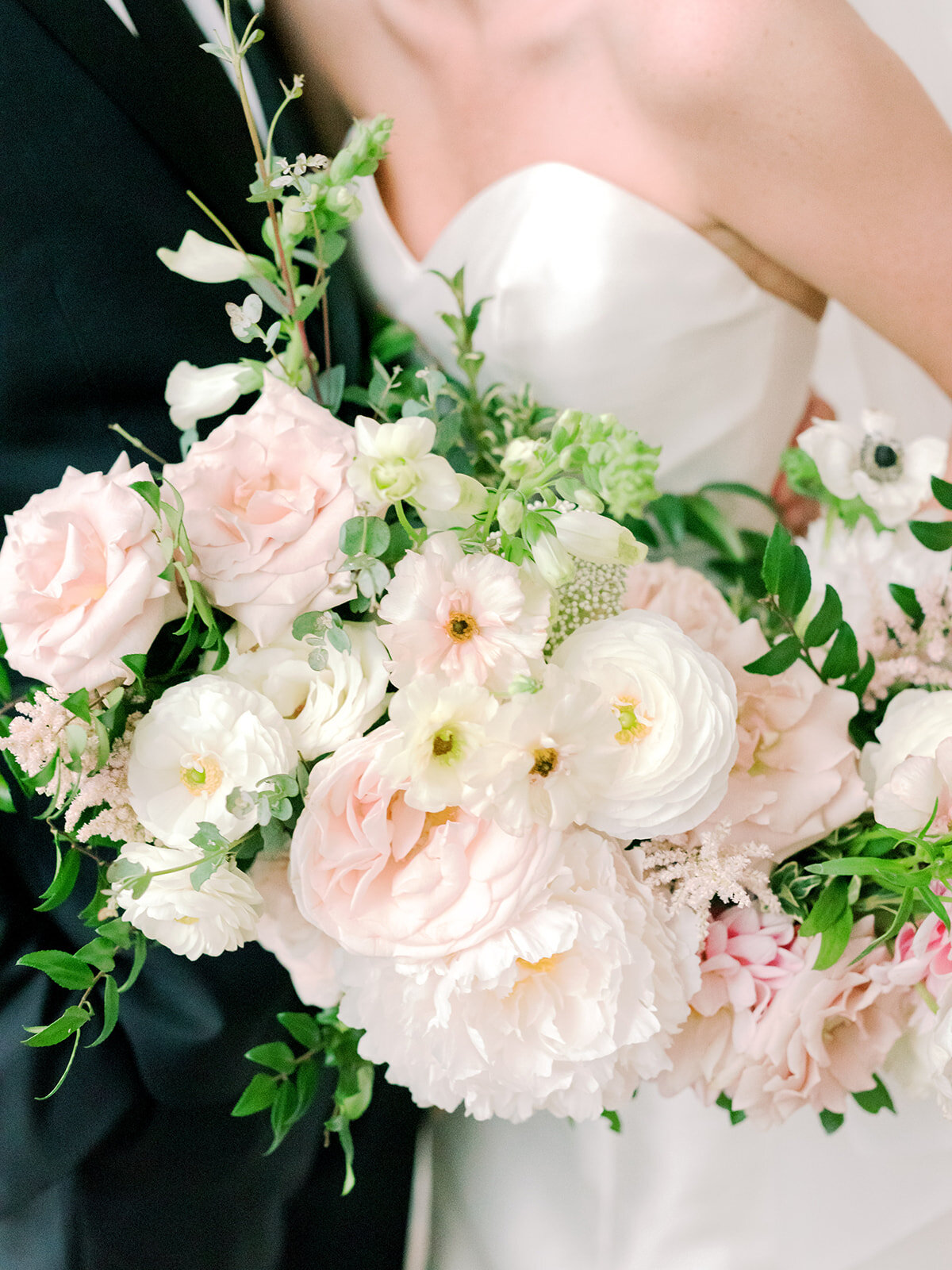 Garden-inspired bride’s bouquet with blush and white color palette including lots of lush, untamed greenery. Nashville wedding floral designer, Rosemary and Finch.