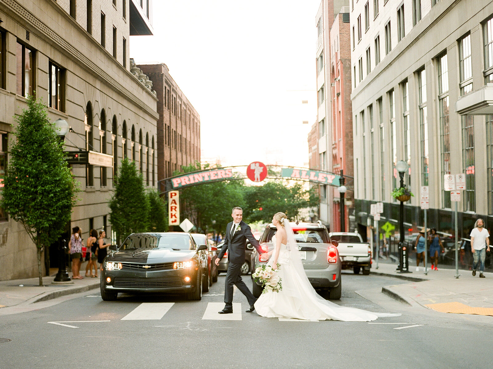 Downtown Nashville bride and groom portraits with blush and ivory color palette.