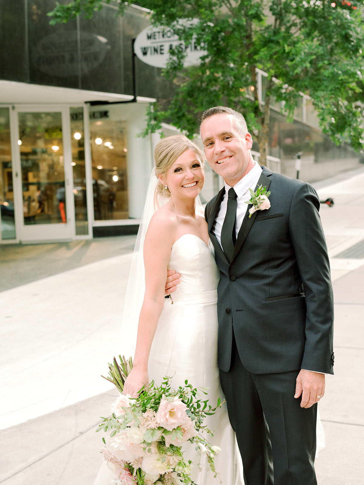 Downtown Nashville bride and groom portraits with blush and ivory color palette.