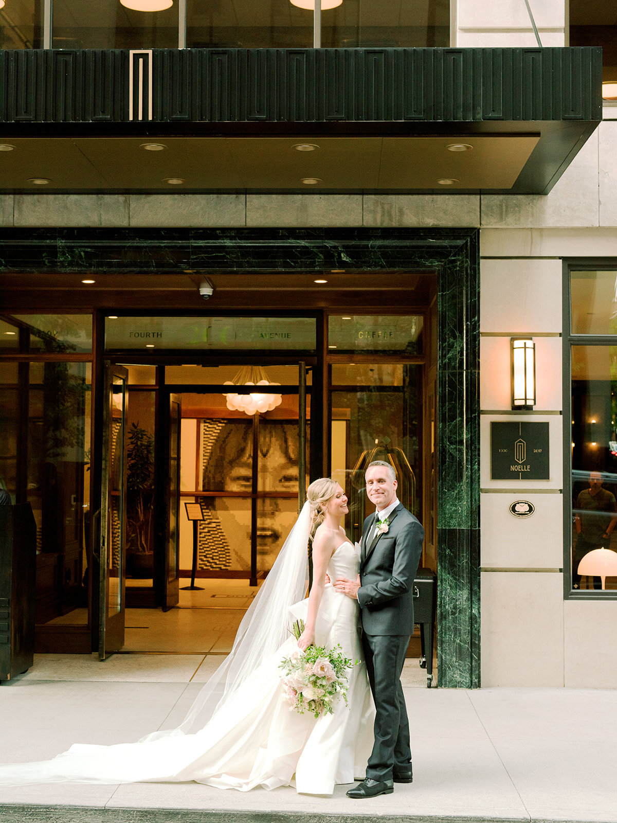 Downtown Nashville bride and groom portraits with blush and ivory color palette.