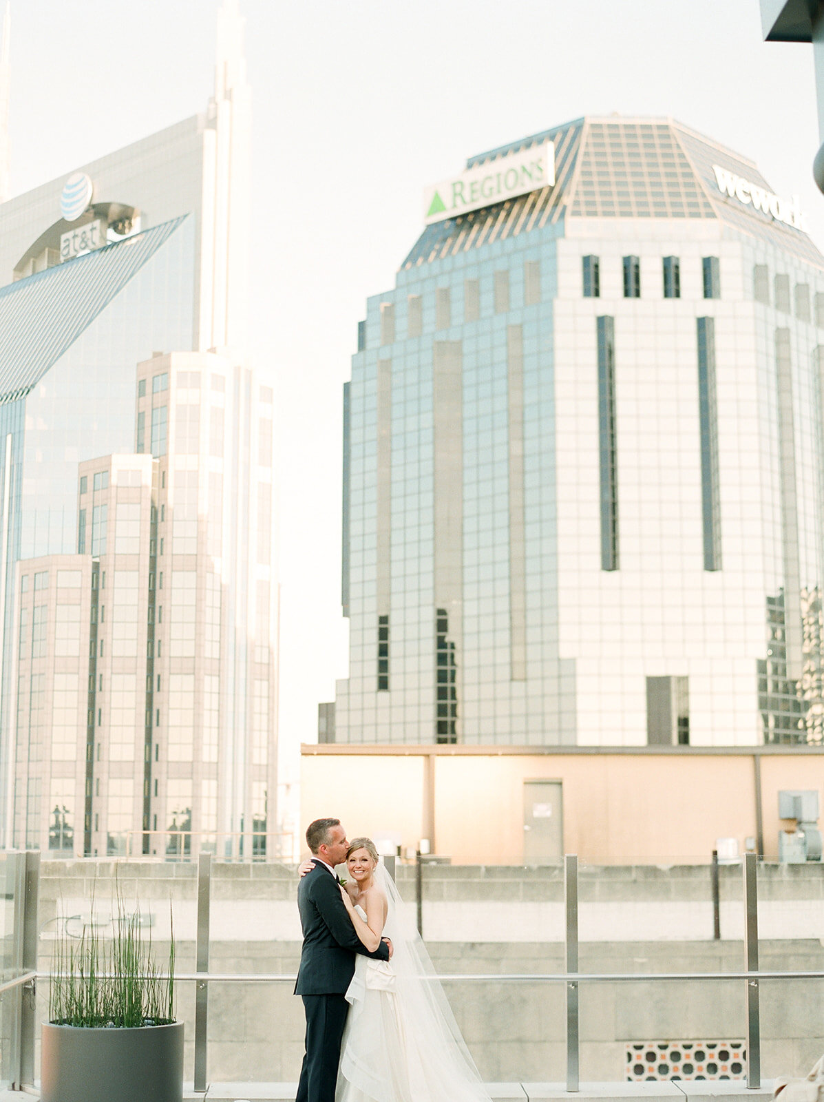 Downtown Nashville bride and groom portraits with blush and ivory color palette.