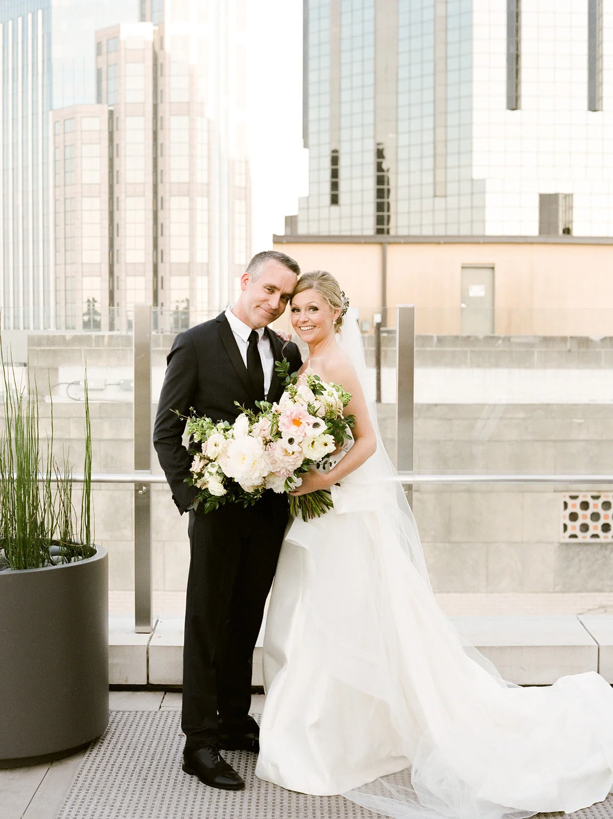 Downtown Nashville bride and groom portraits with blush and ivory color palette.