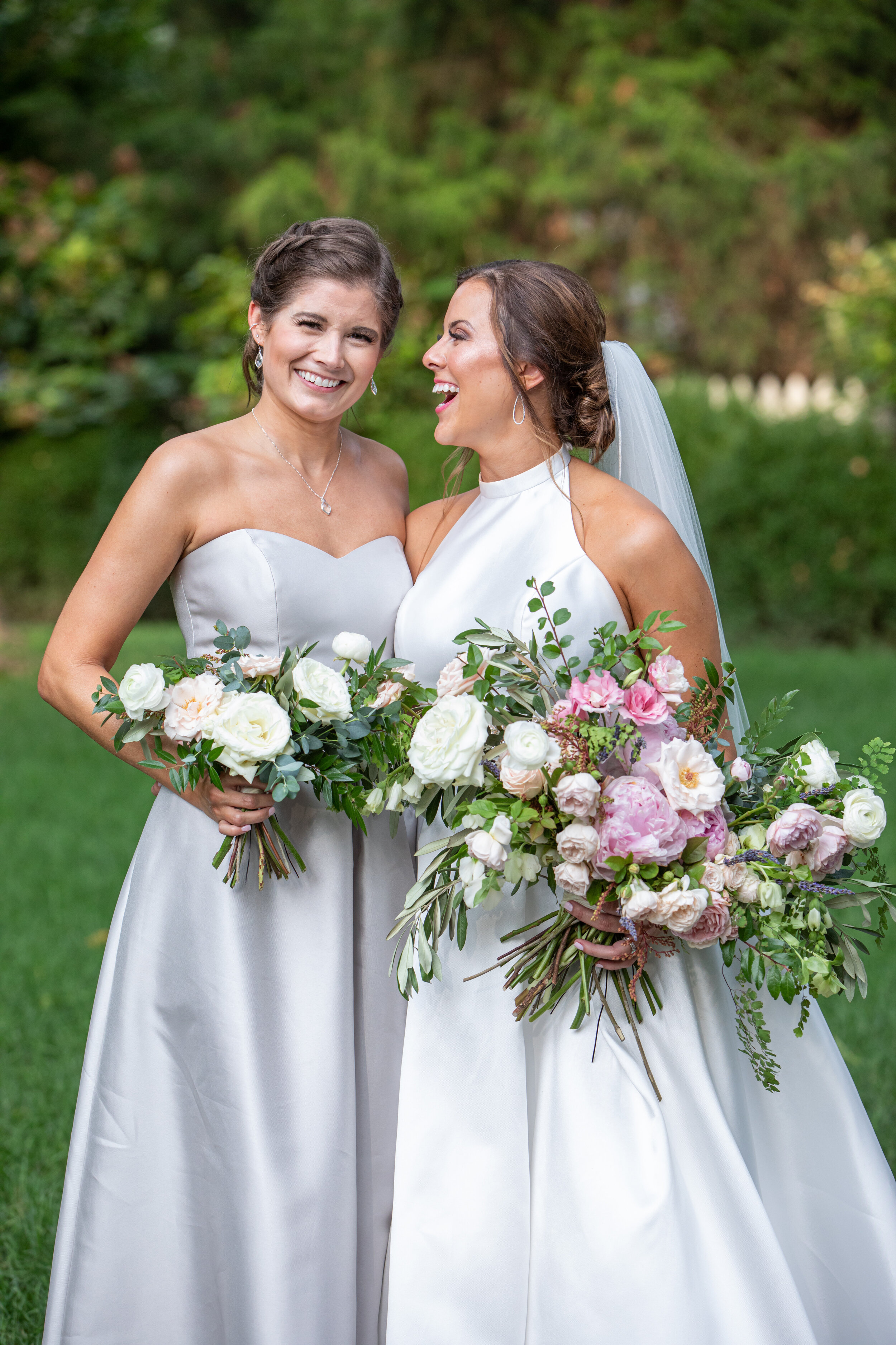 Silk bridesmaid gown with garden-inspired flowers, using peonies, ranunculus, garden roses, and ferns in shades of soft pink, blush, white, and ivory. Nashville wedding floral design.